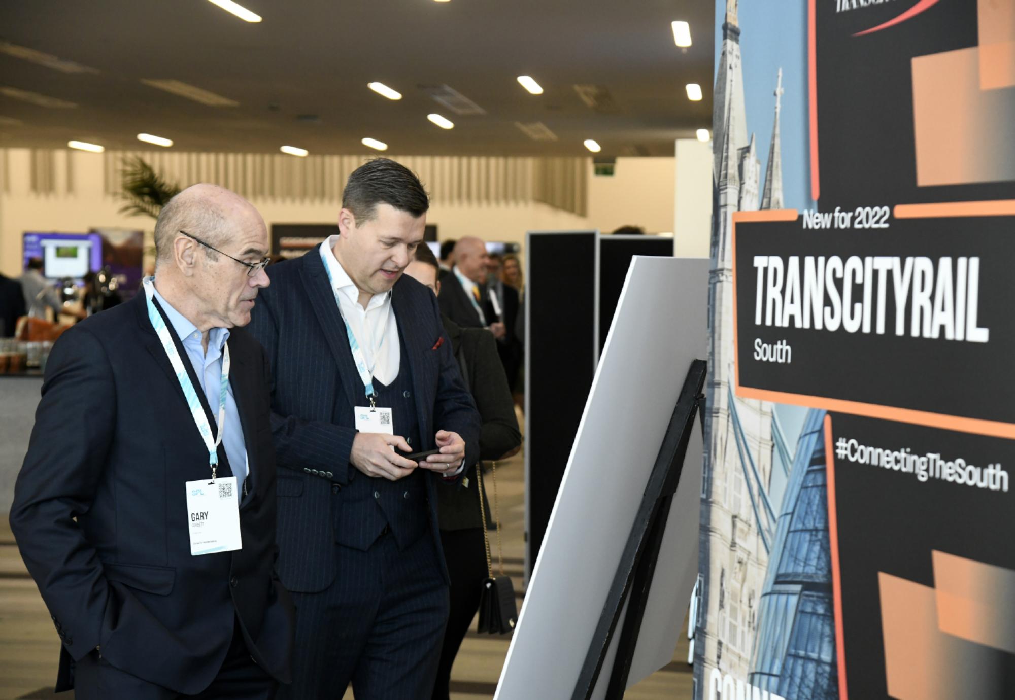 Attendees looking at exhibit at TCR Midlands 2022 event