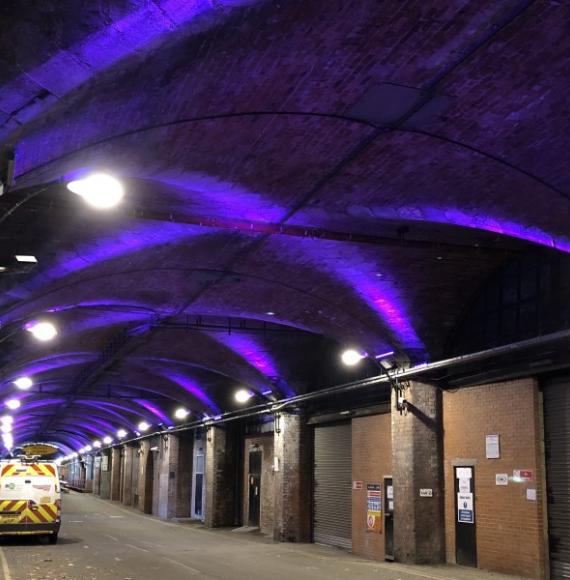 Station with purple lights on the wall 