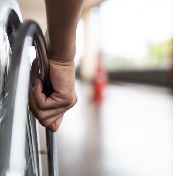 Wheelchair user on an out-of-focus platform