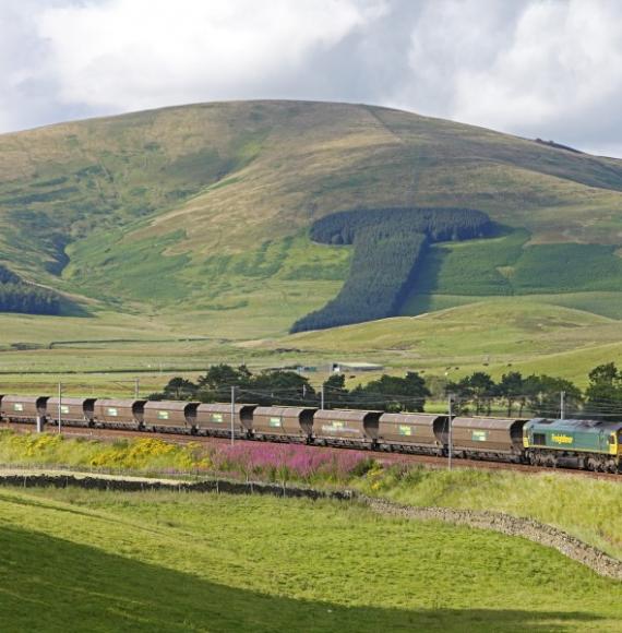 reightliner Heavy Haul coal train as it passes through scenic Scottish countryside.