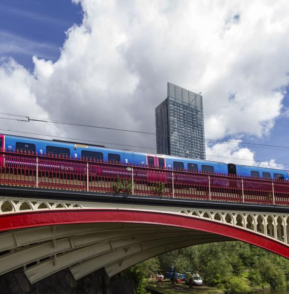 Train passing over a bridge in Manchester