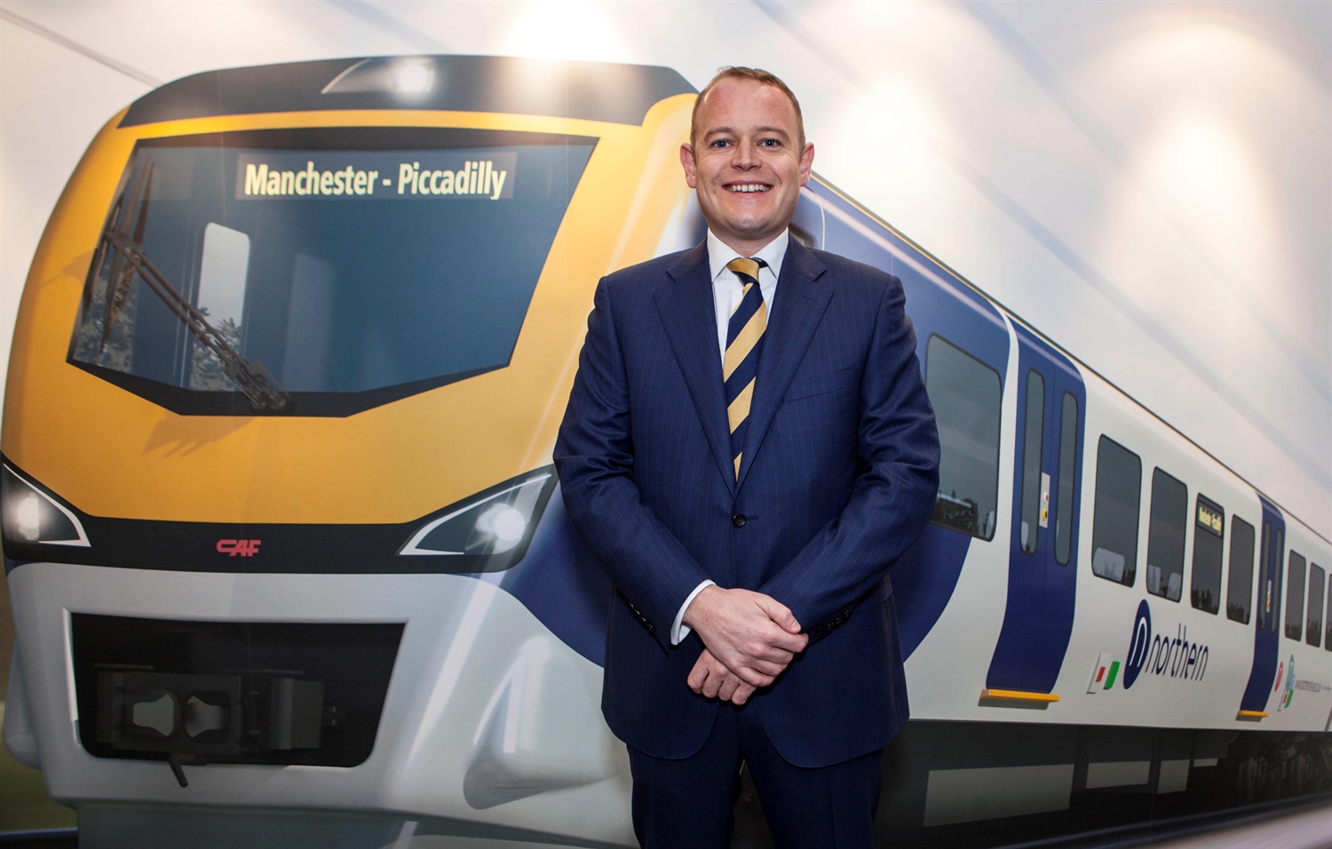 Alex Hynes Managing Director of Northern with a visualisation of a new-look Northern train on the first day of the Northern Franchise
