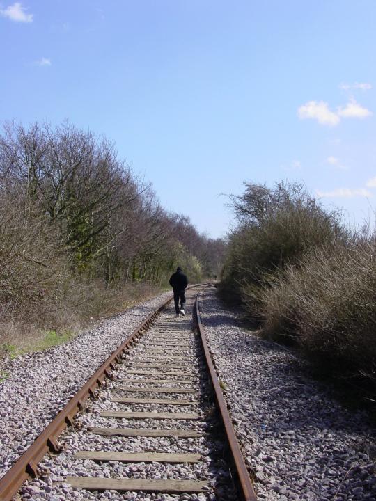 Man waling on the tracks