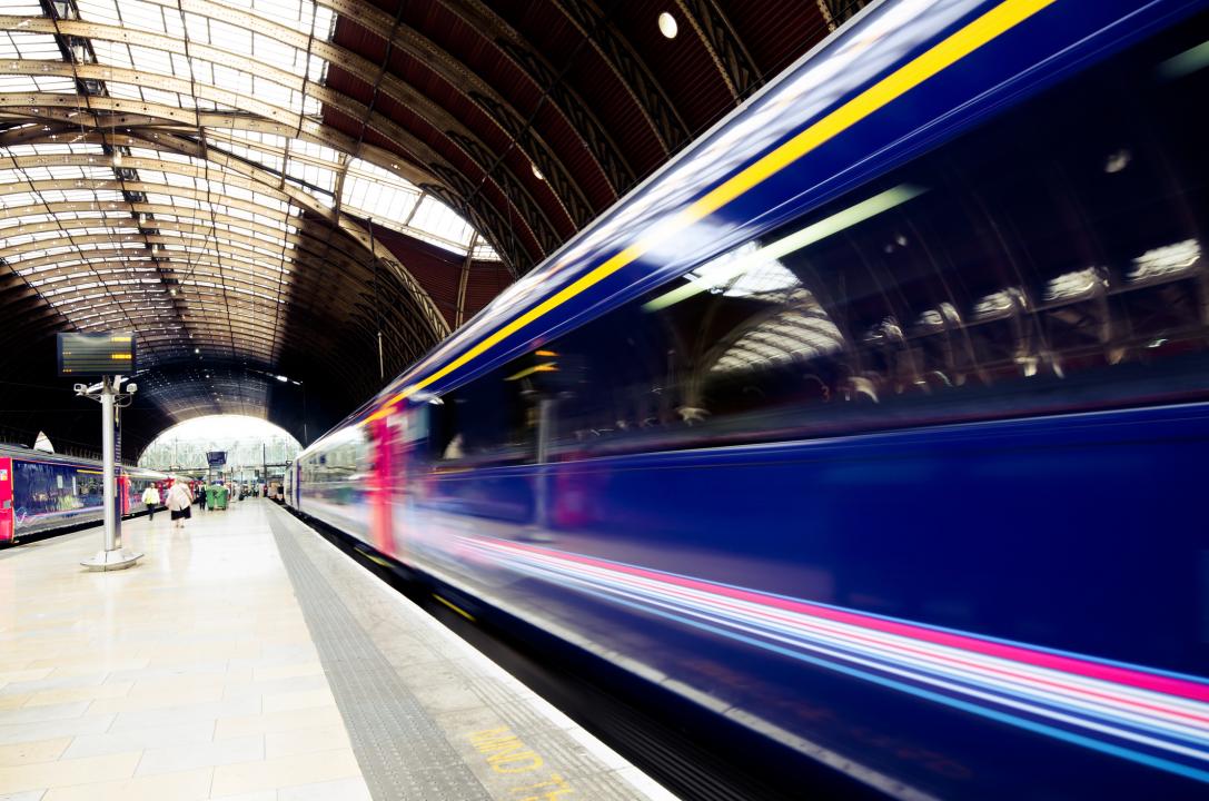 Train in motion at a railway station