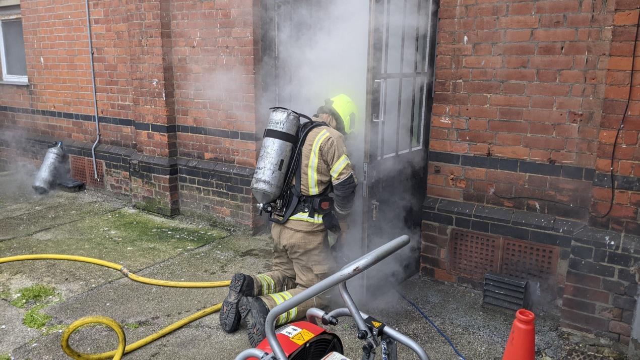 Smoke coming out of a door 