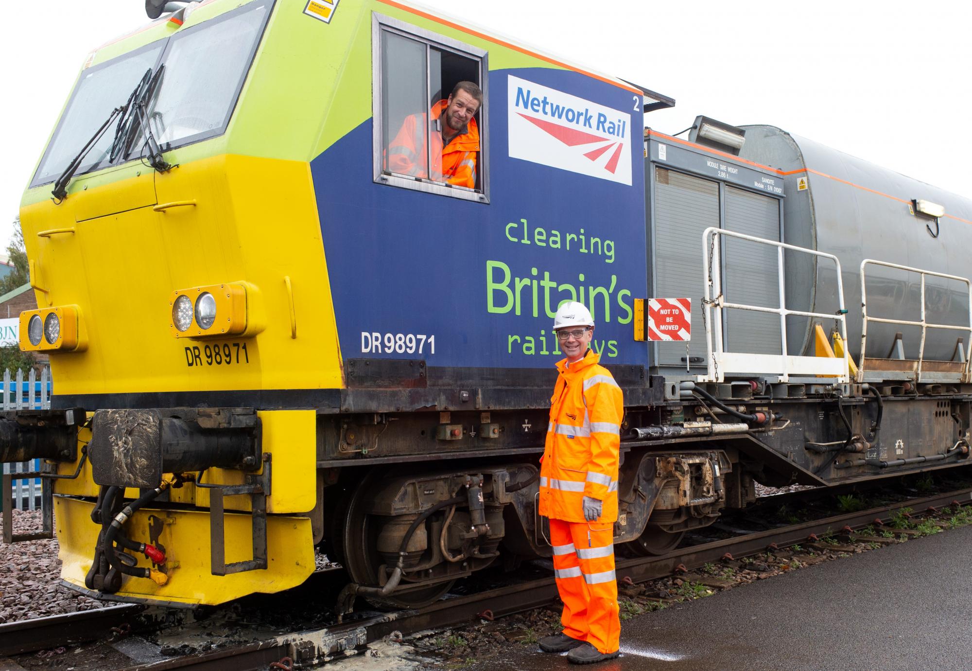 Paul Plawecki of Balfour Beatty and Rob Davis of Network Rail with a leaf-busting train