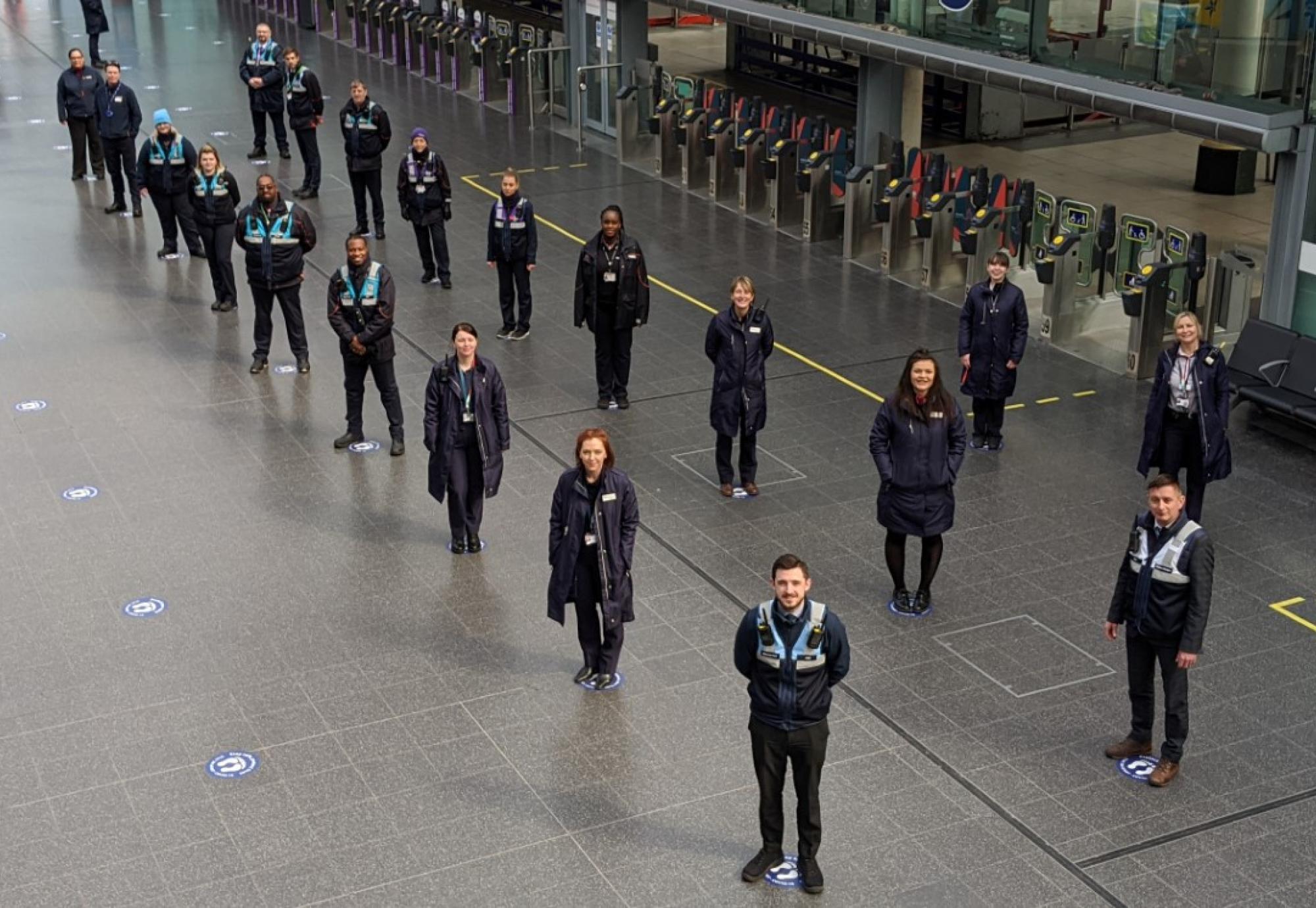 Train crew and station staff on the social distancing guides at Manchester Piccadilly