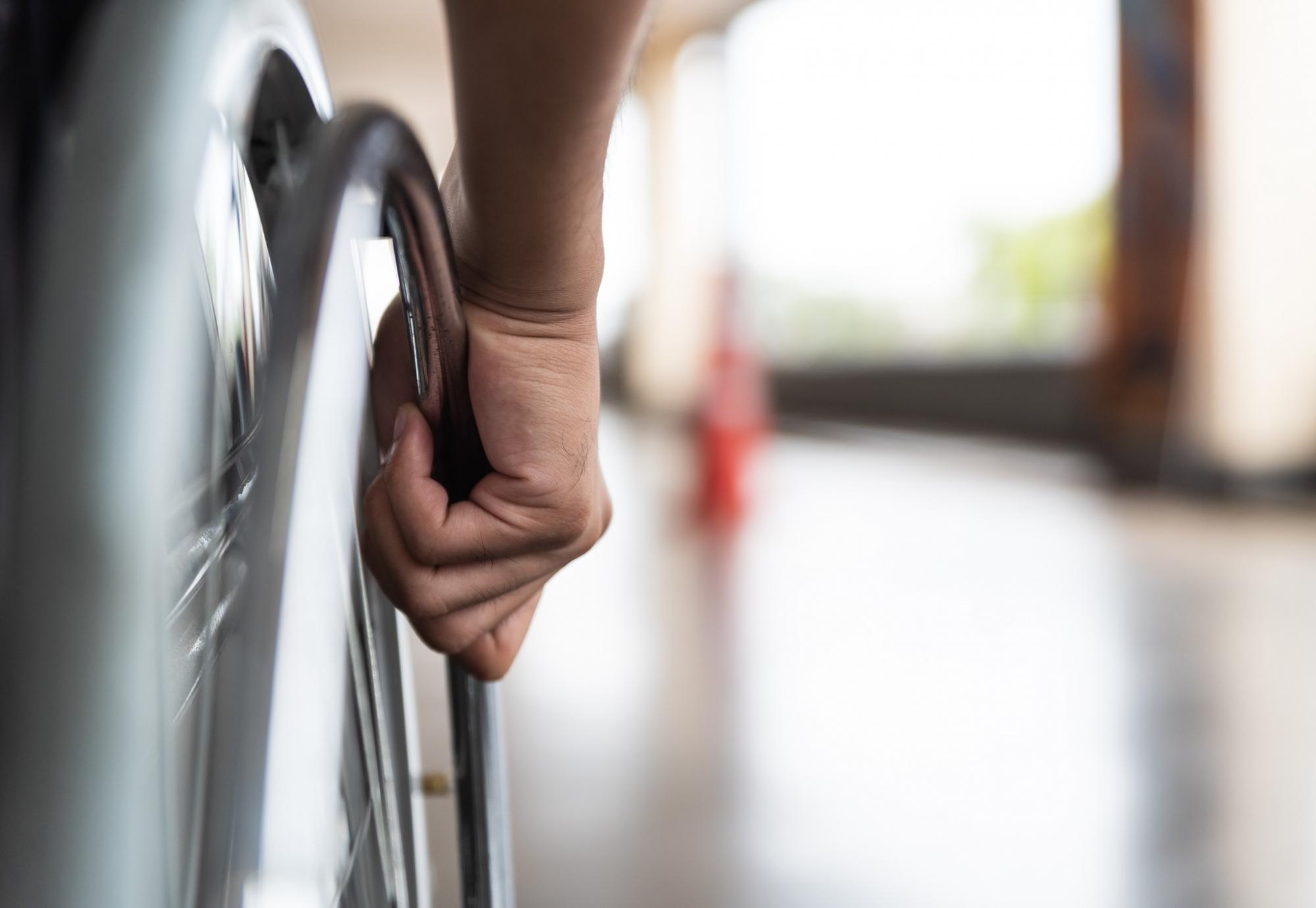 Wheelchair user on an out-of-focus platform