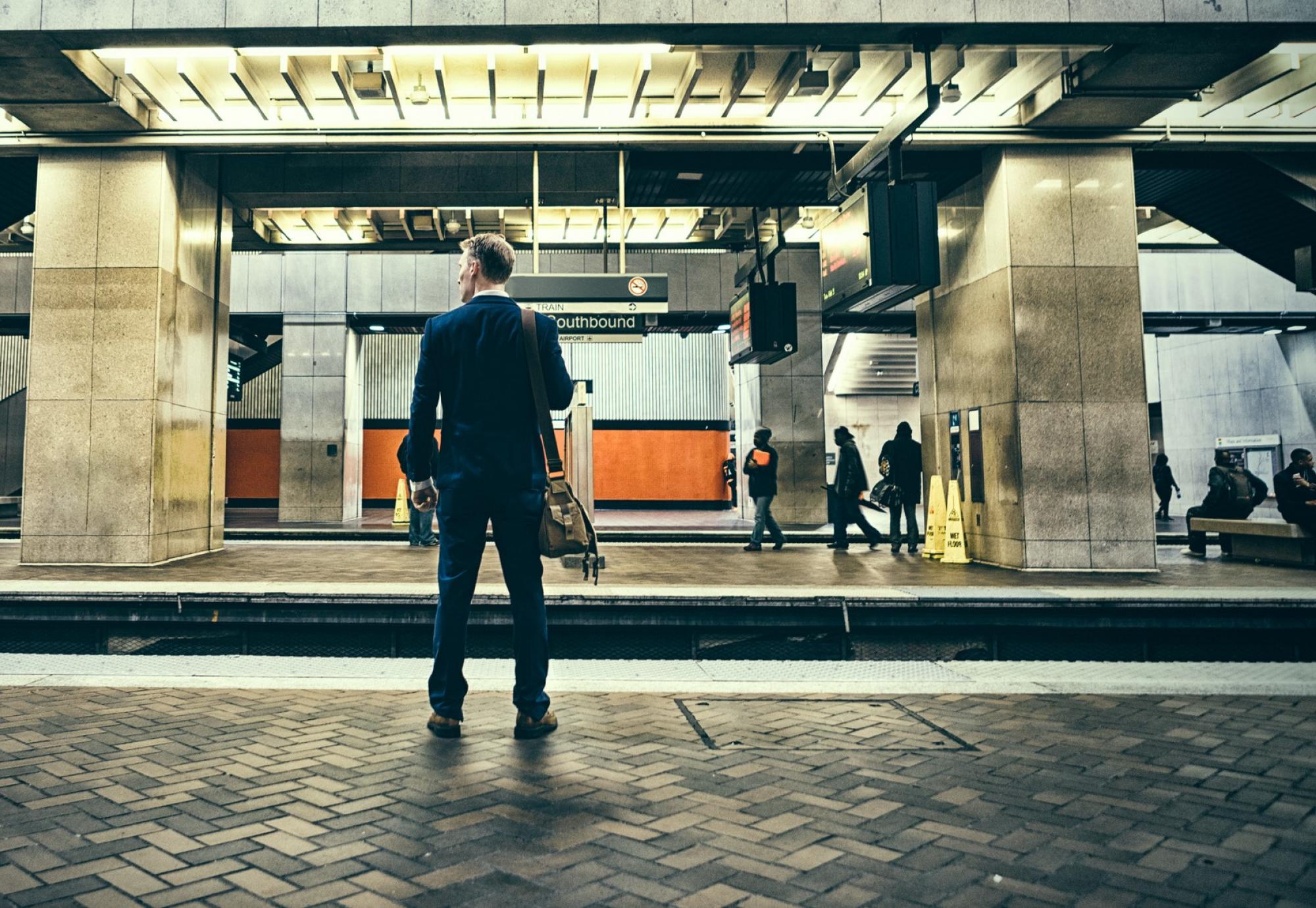 Businessman waiting at a train platform