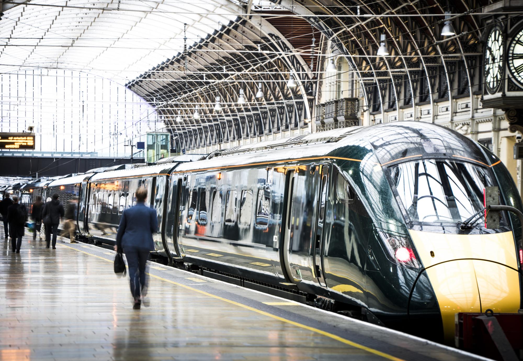 Commuters wander around a train platform