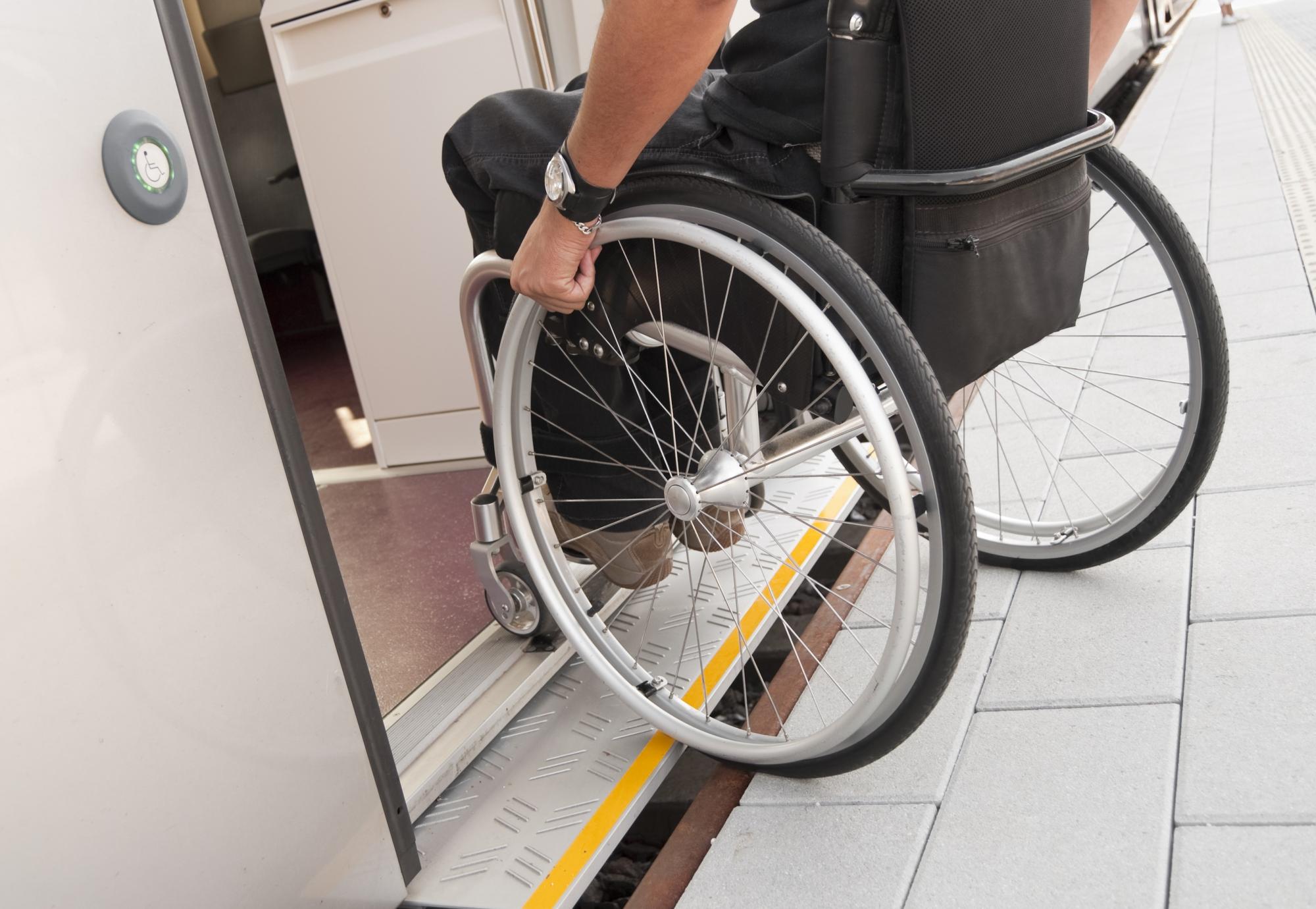 Wheelchair user boarding a train
