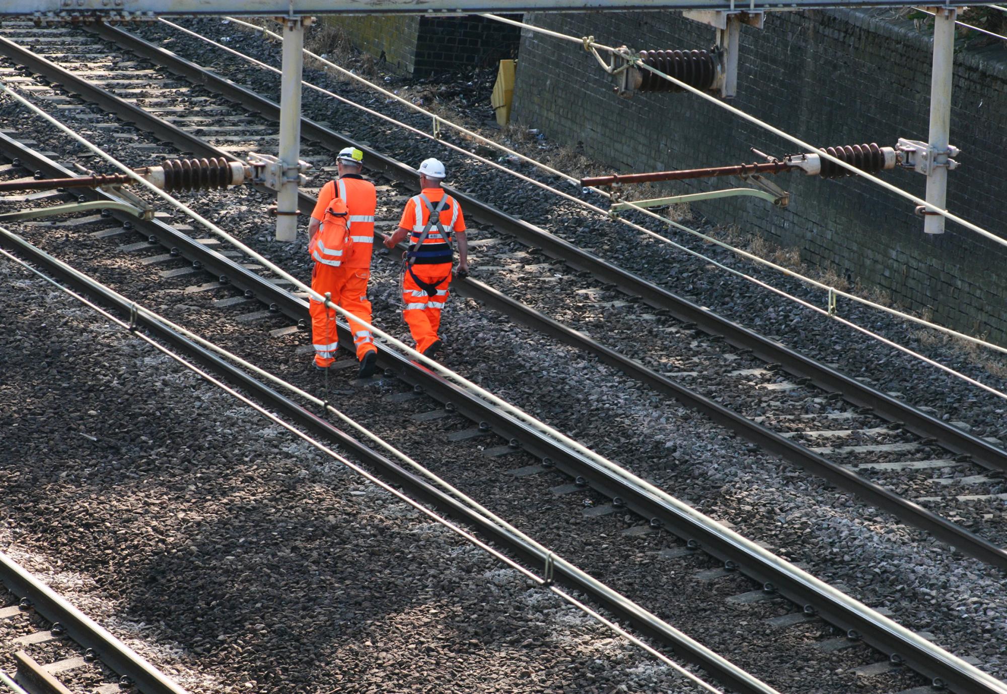 Rail workers on the train line