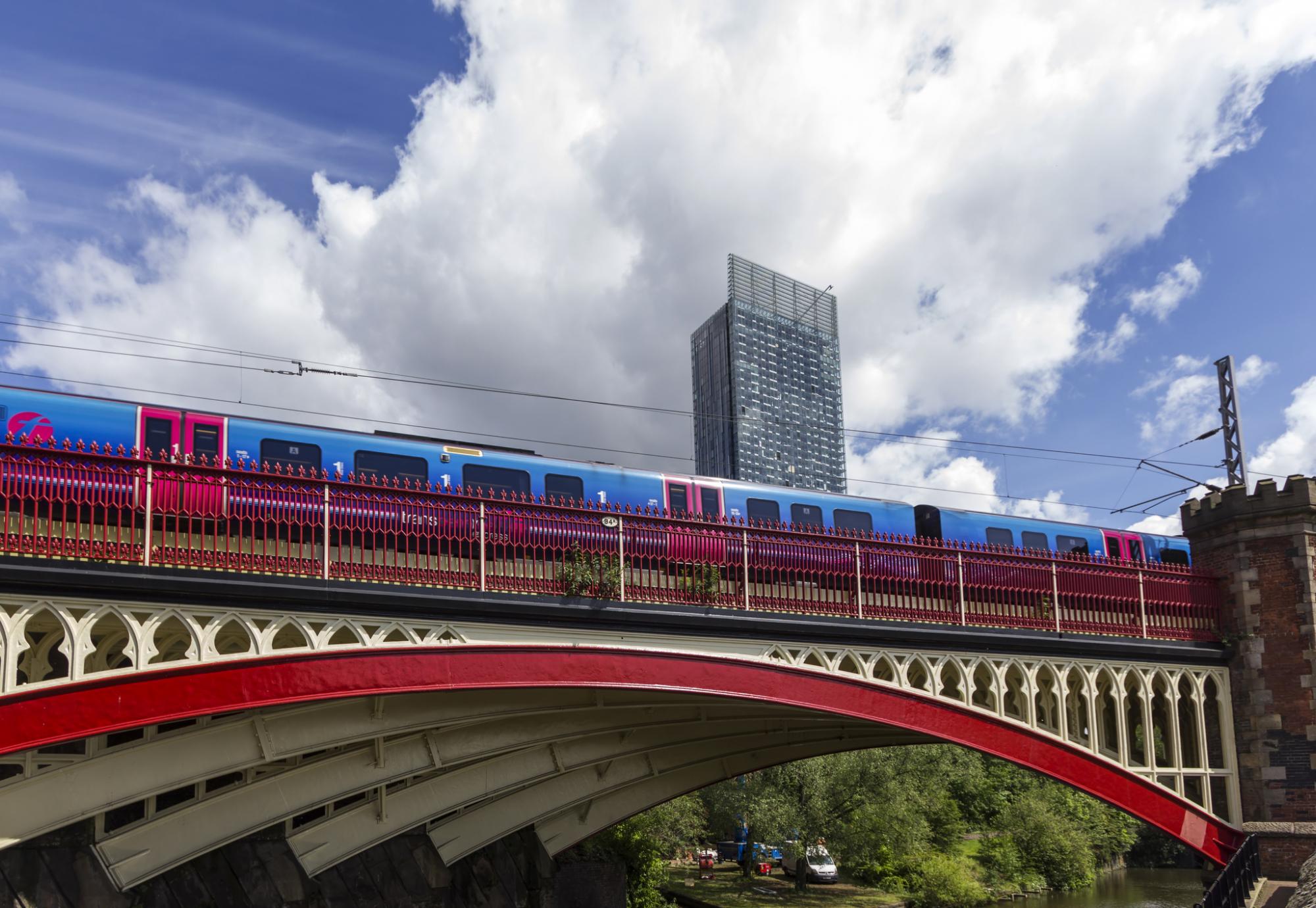 Train passing over a bridge in Manchester