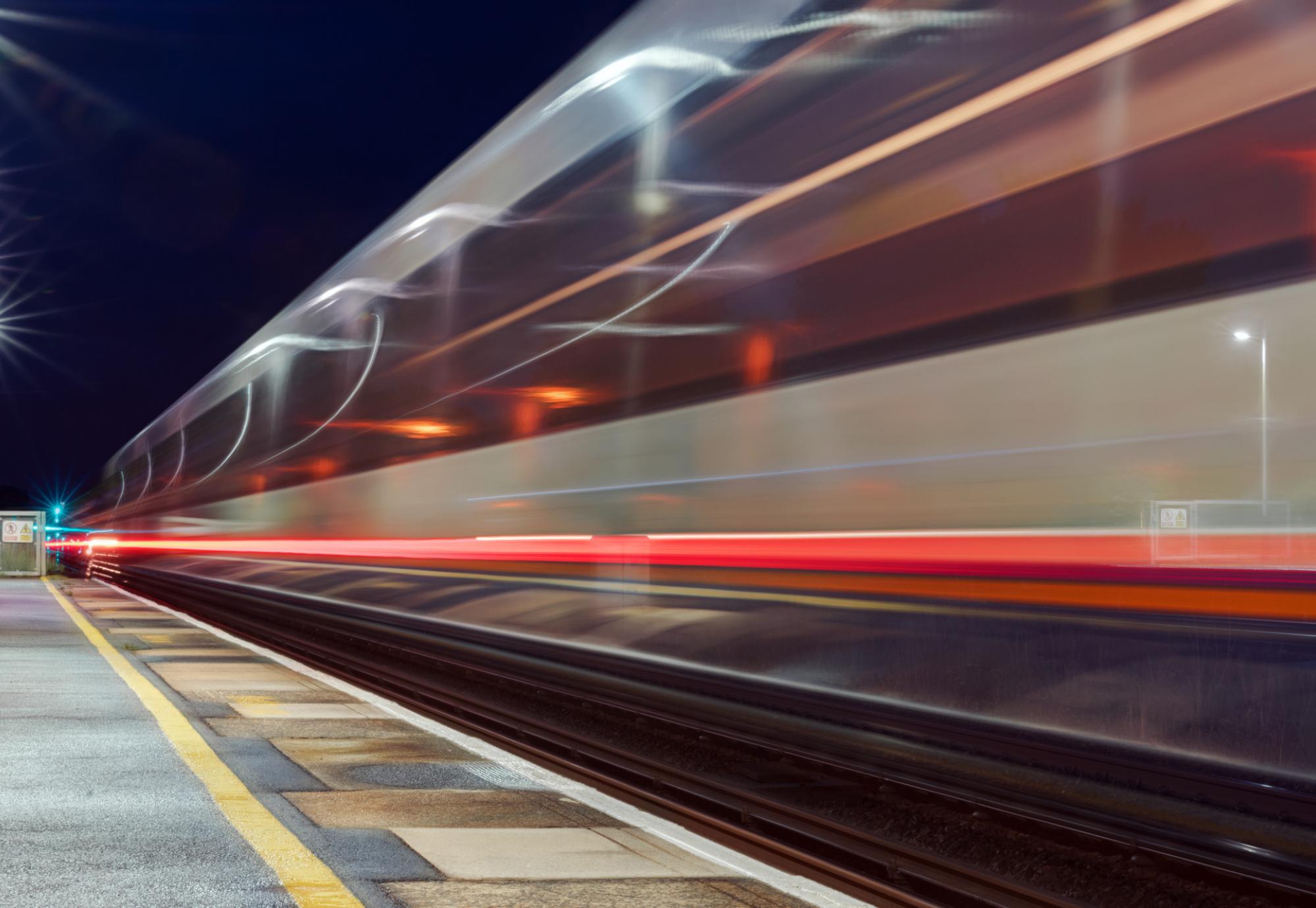 Train in motion at a platform