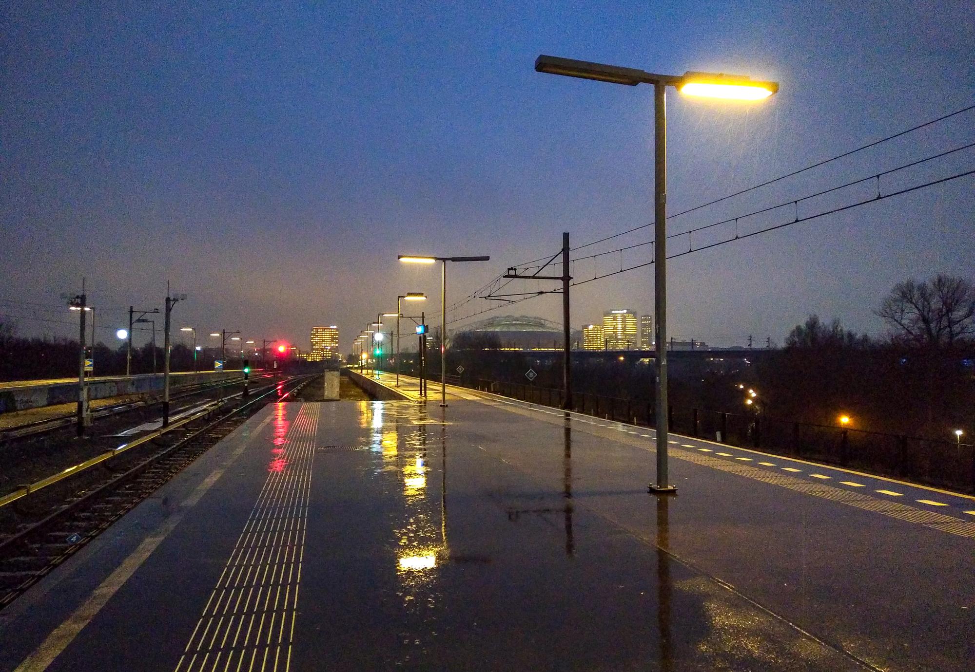 Railway platform during heavy rain