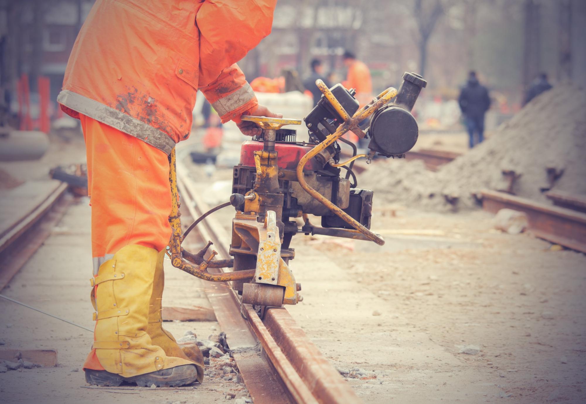 Welder performing work on a section of track