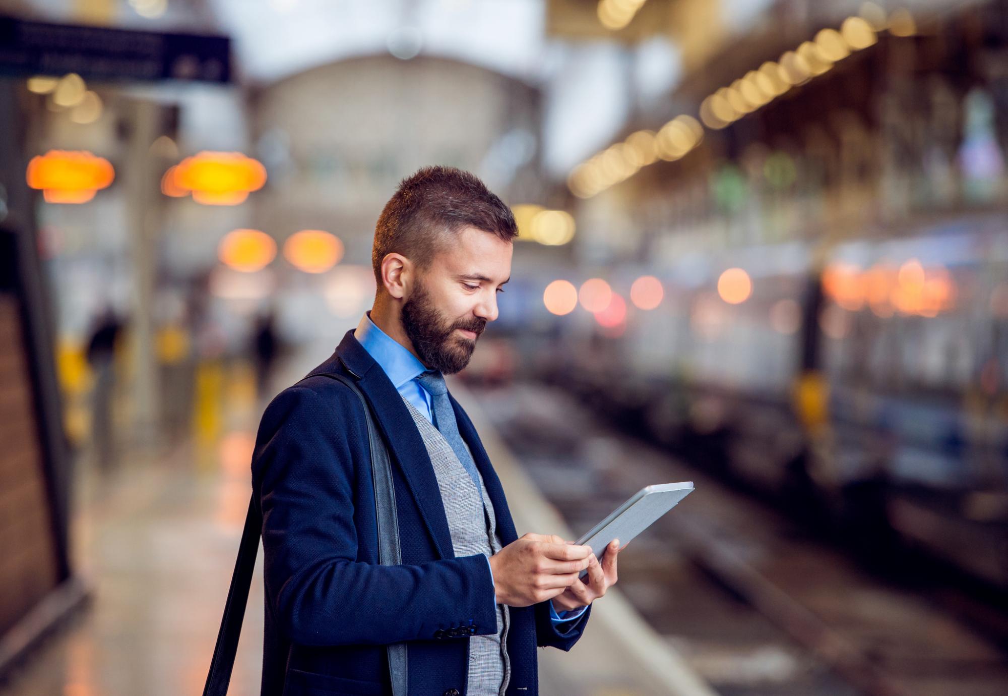 Businessman waiting for a train in London