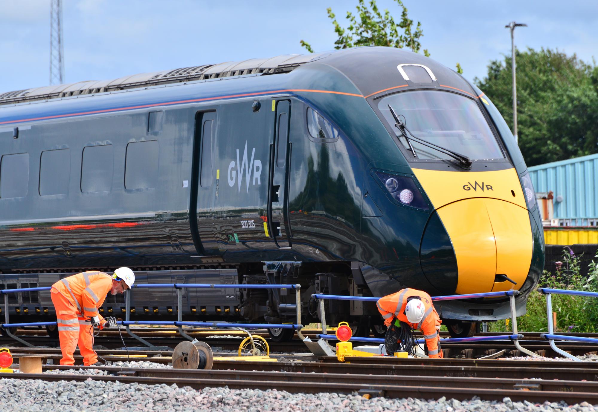 Engineers working in front of the train