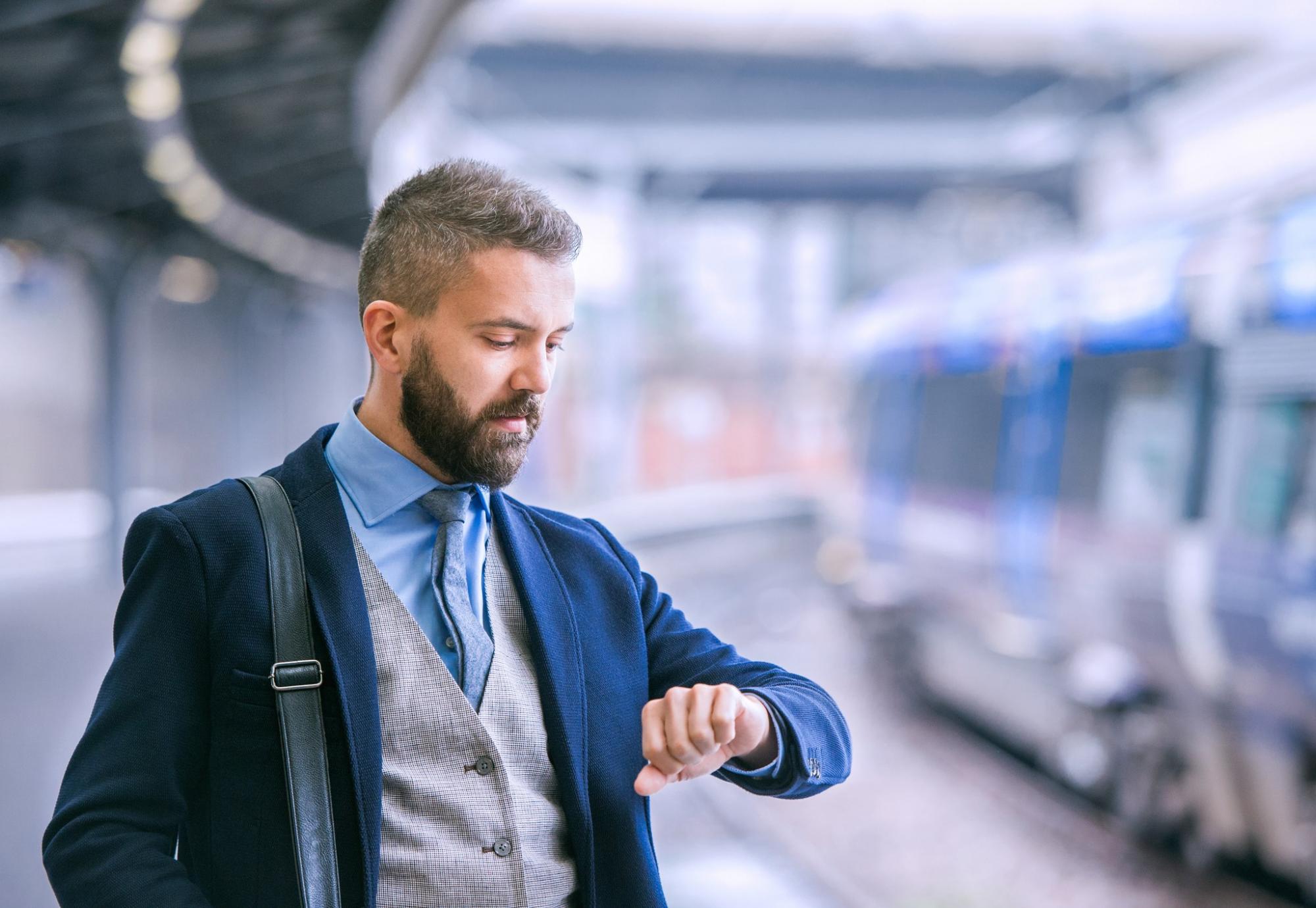 Businessman at a train platform