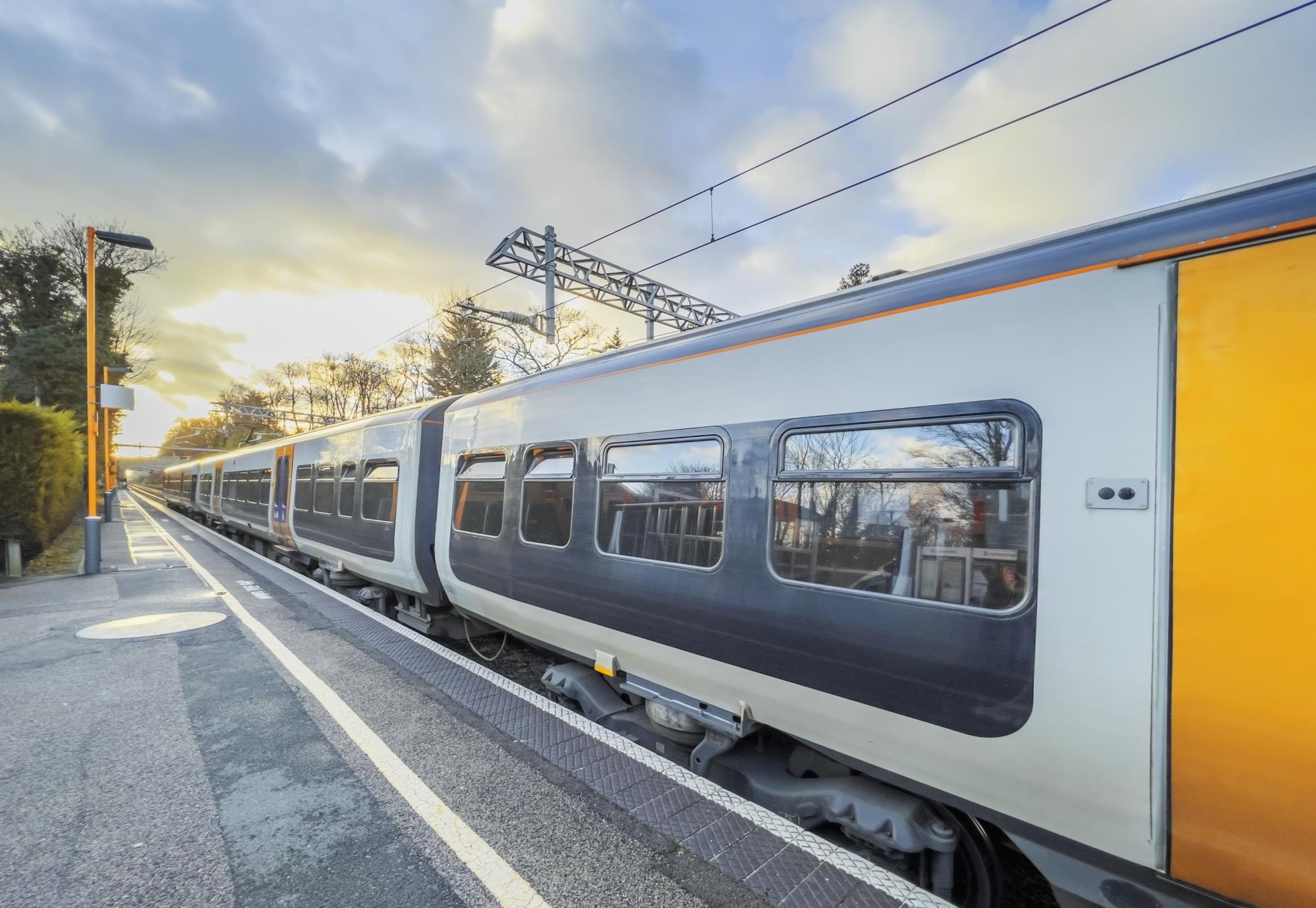  An electric powered train passes through the British Rail station, via Istock 