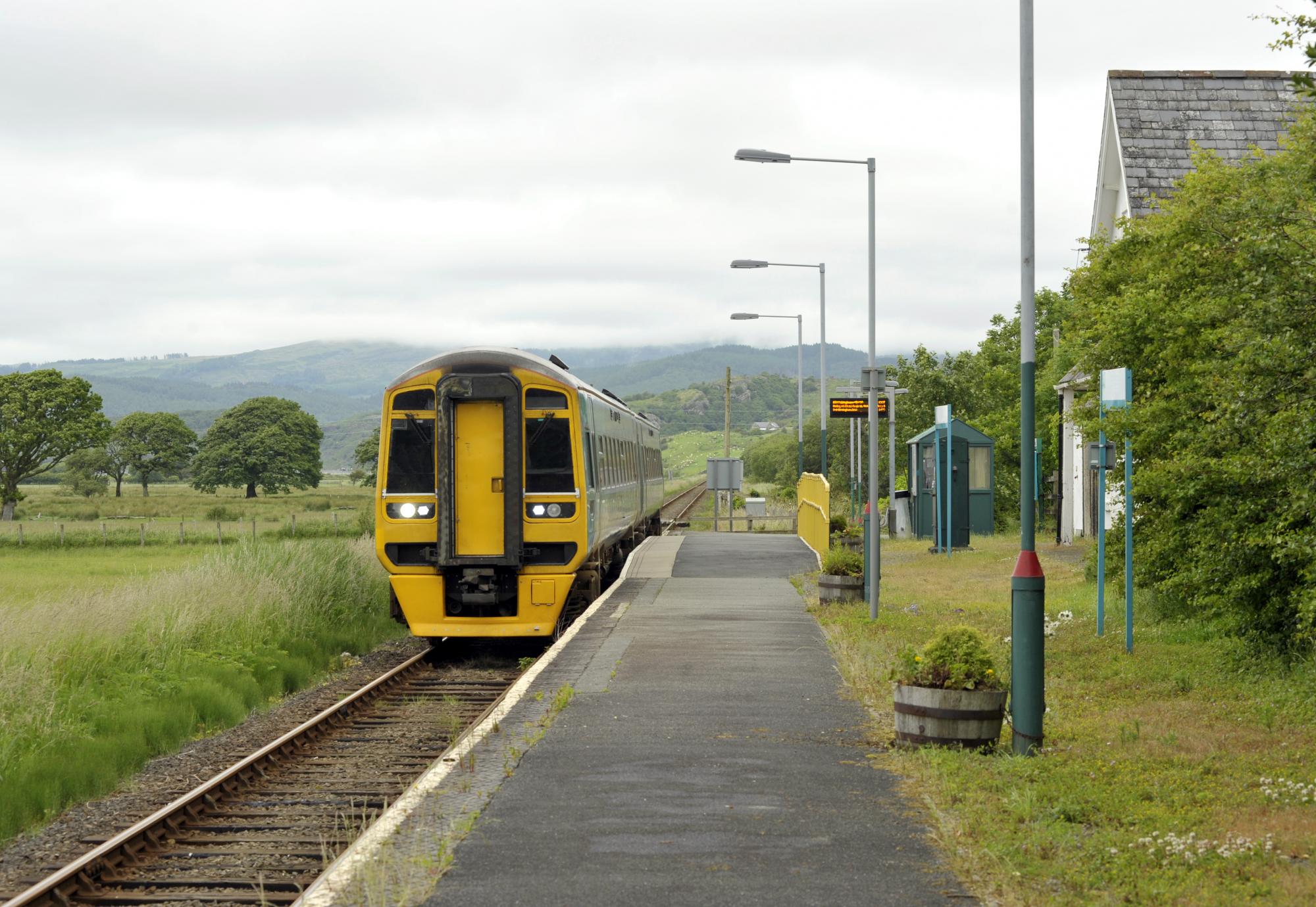 Railway diesel train locomotive at rural Talsarnau station, Gwynedd in North Wales UK, via Istock