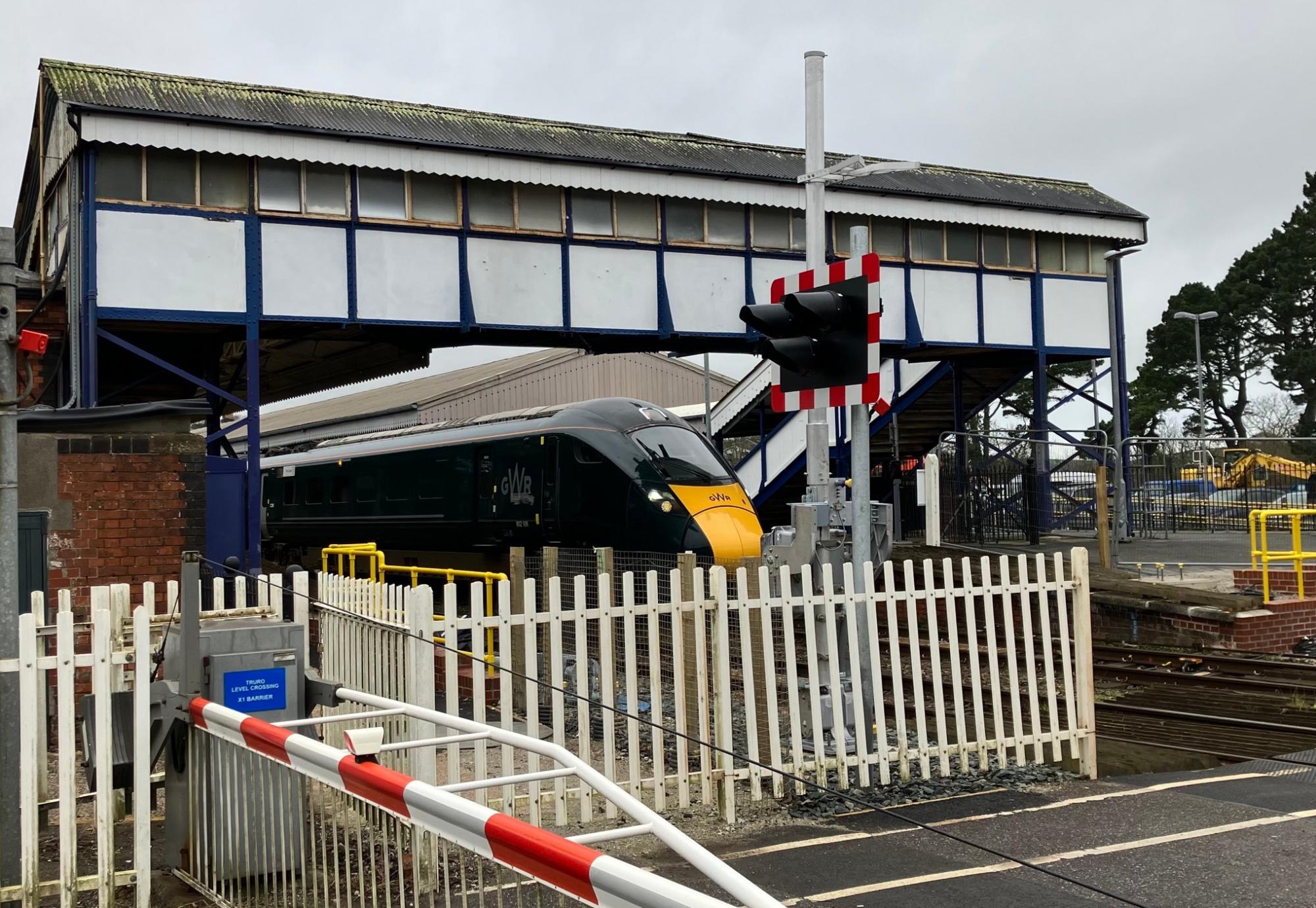 GWR train at Truro station with level crossing that will be upgraded