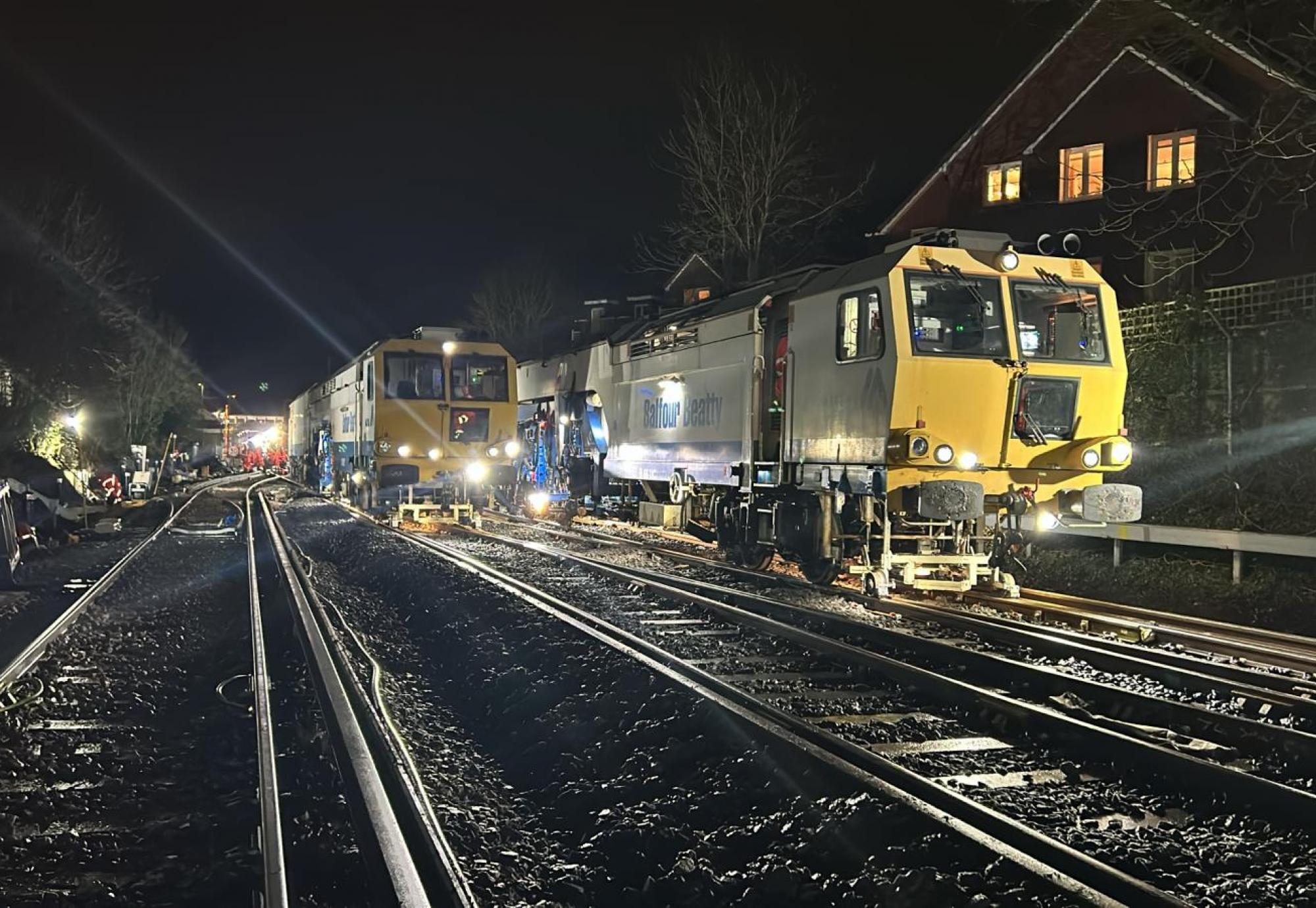 A tamping machine working at night in Wokingham