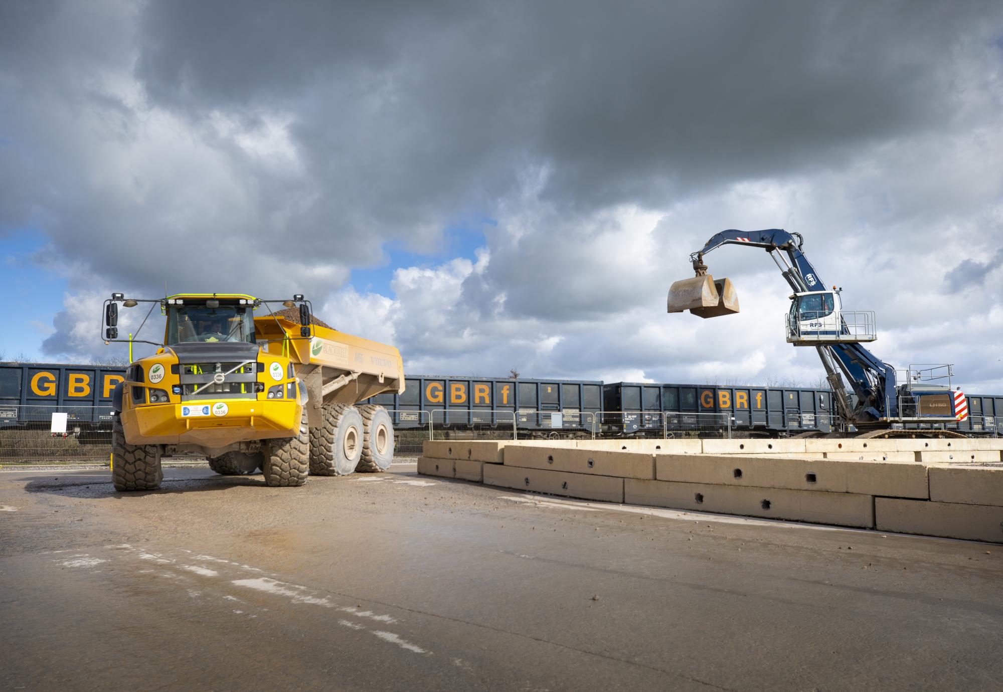 Material delivered by rail to Quainton railhead is taken away on an articulated dumper truck Feb 2024