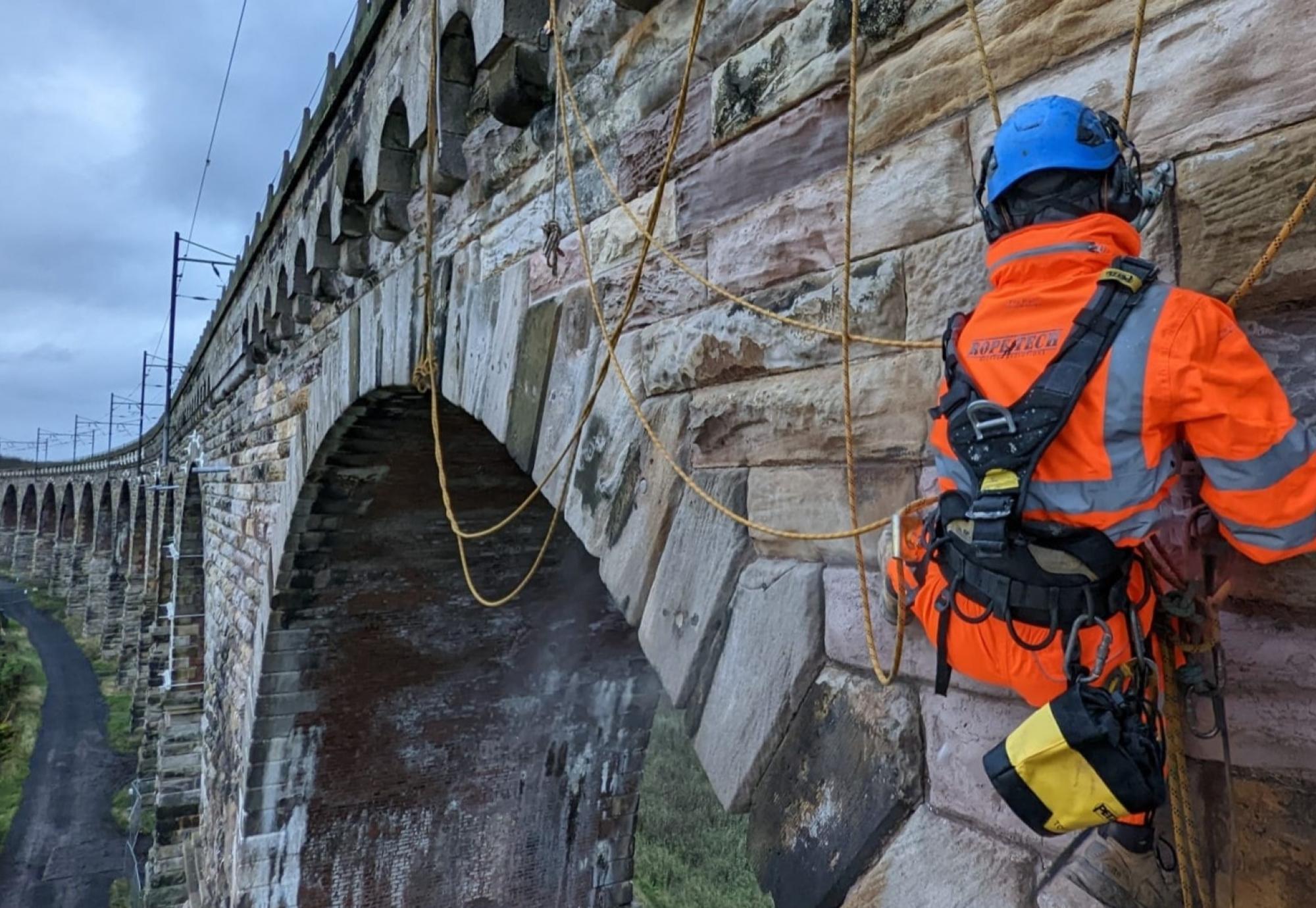 Man working on rail bridge 