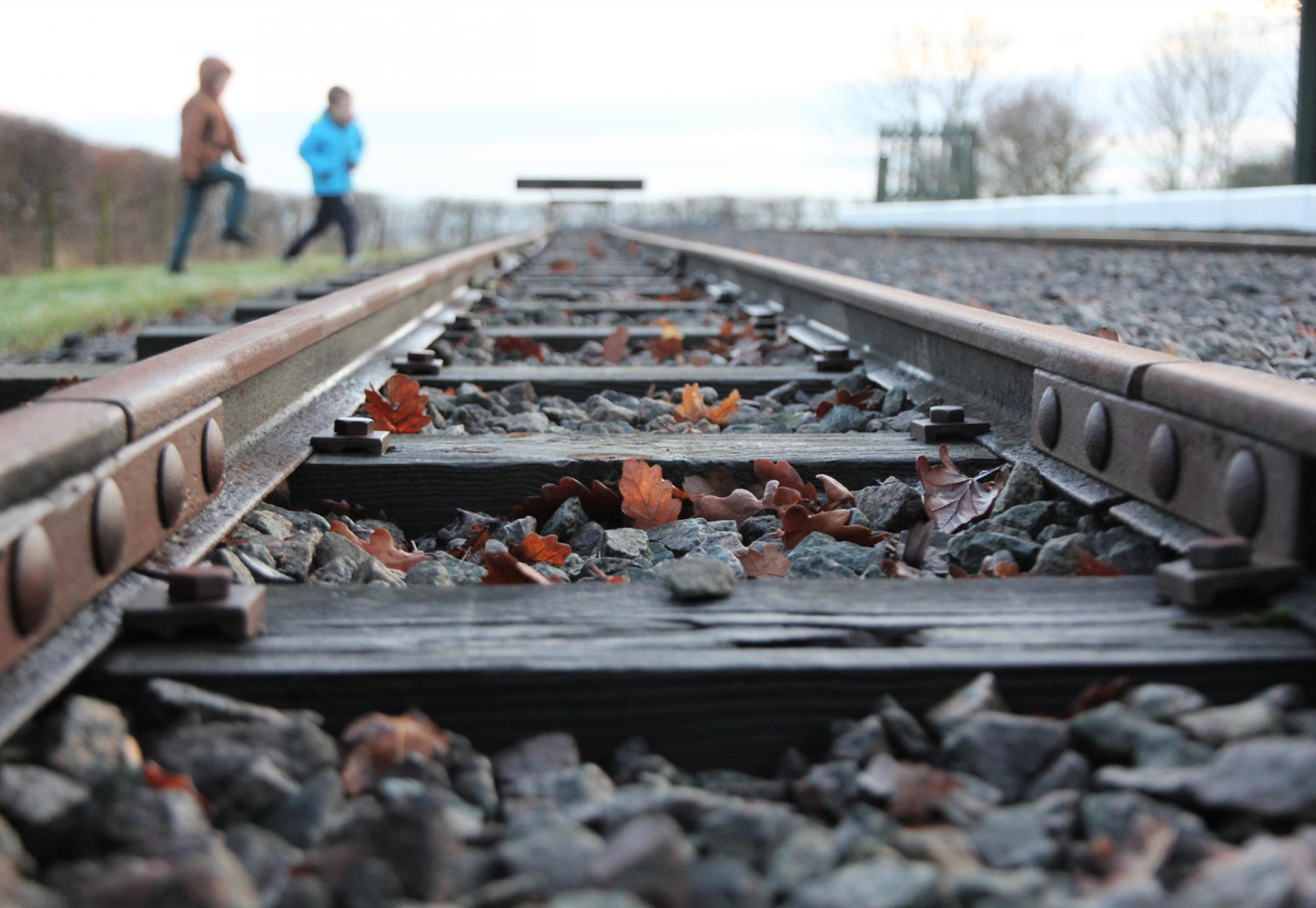 Young children near railway lines