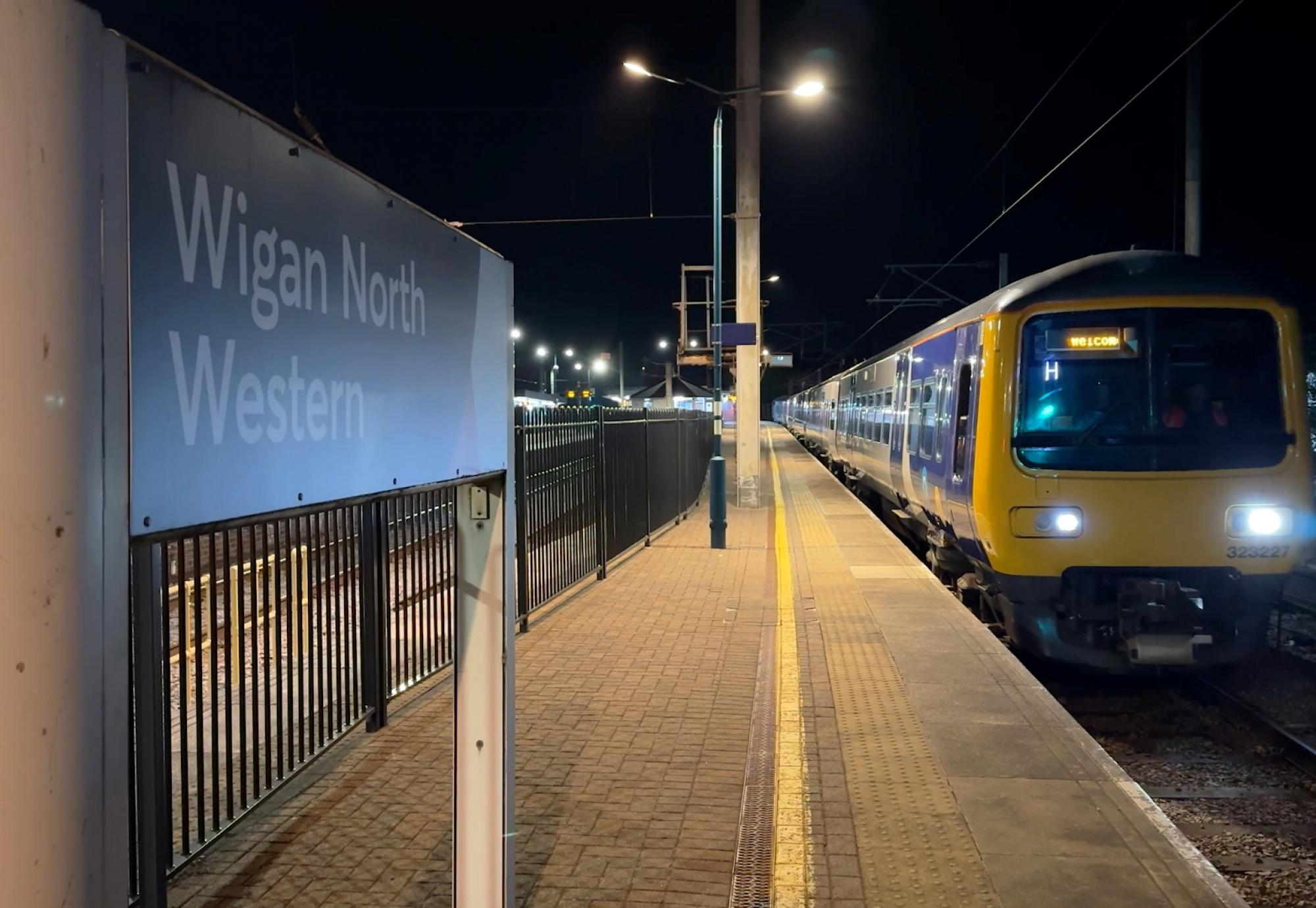 First shot of an electric train leaving Wigan North Western and Bolton under electric power