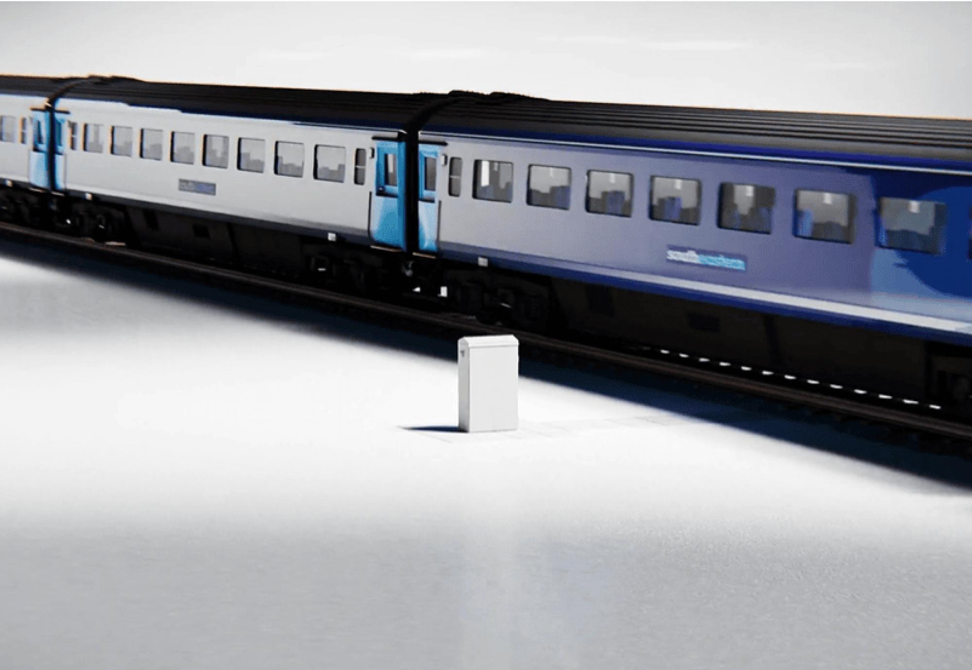 Image of signalling cabinet and train
