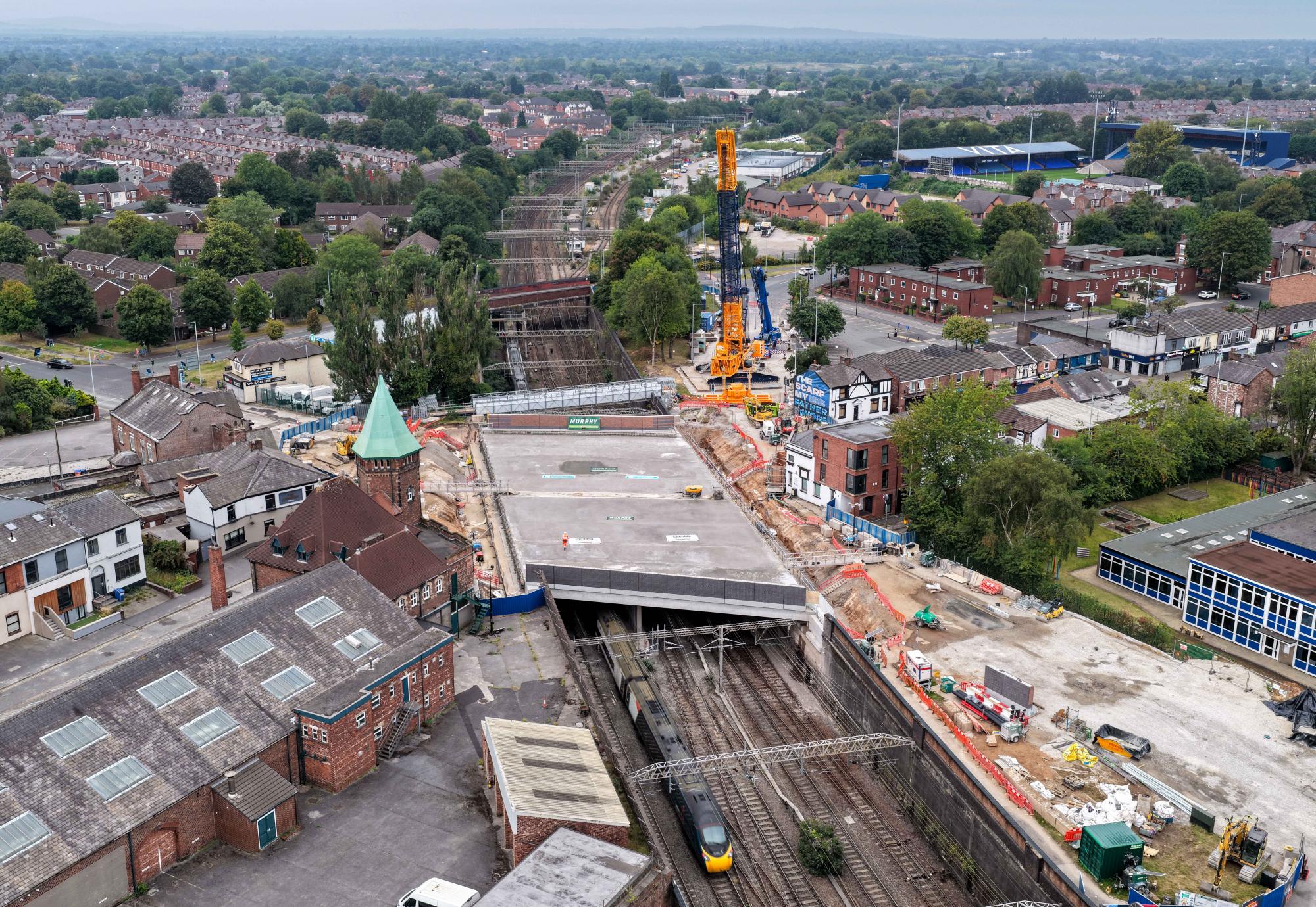 Drone image of first trains running under new Greek Street railway bridge
