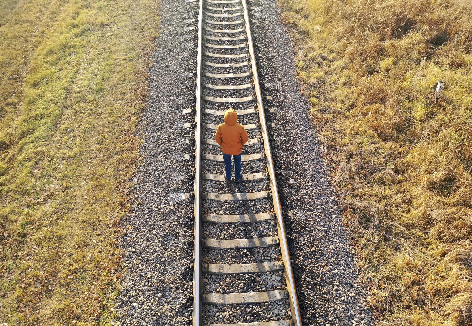 Man stood on train tracks