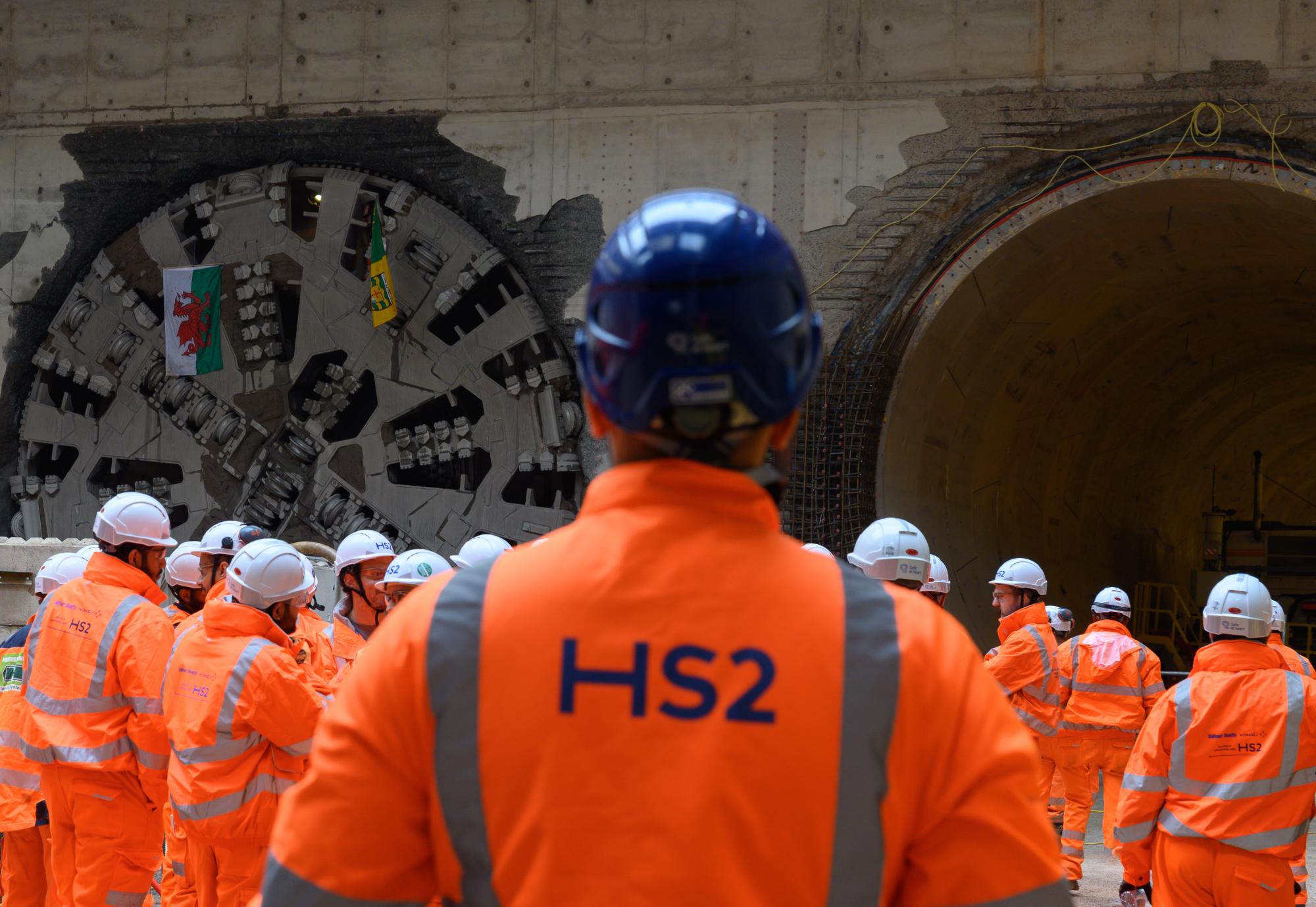 Workers watching the breakthrough