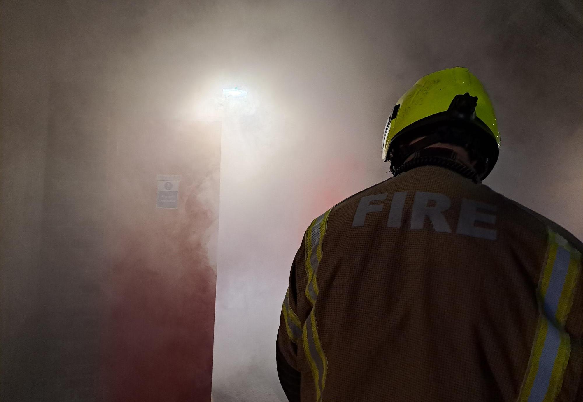 Fireman in smokey room
