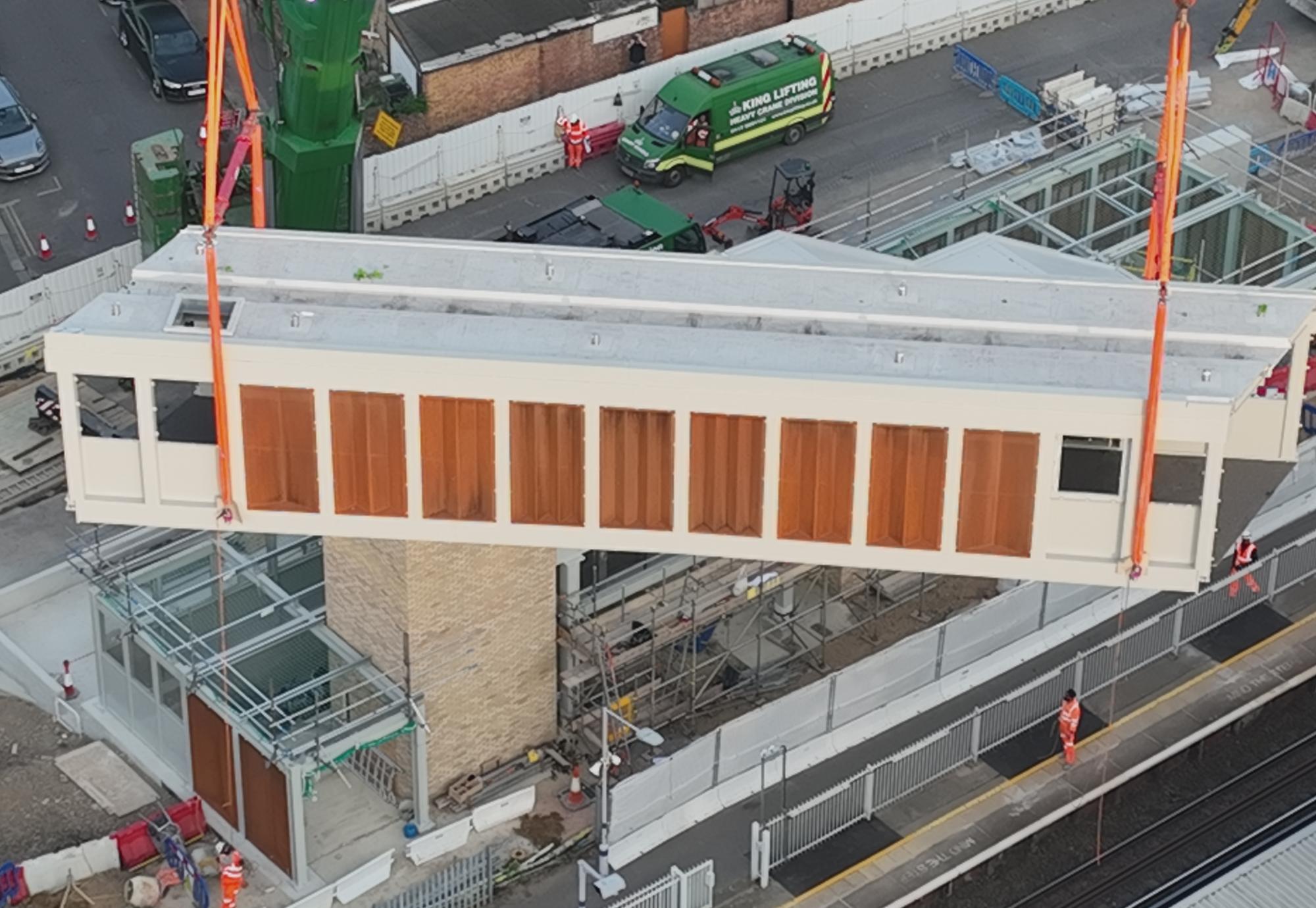 Footbridge section lifted into place at Hither Green