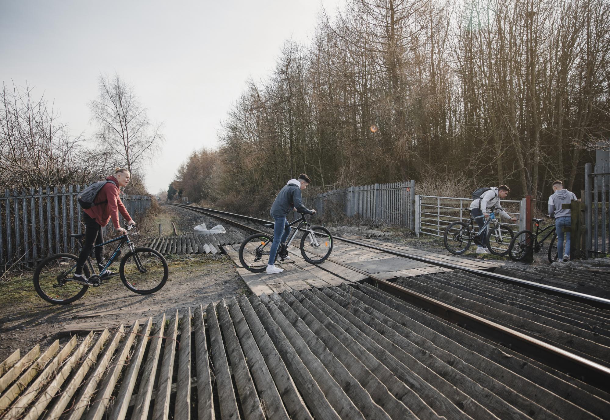Teenagers on a level crossing