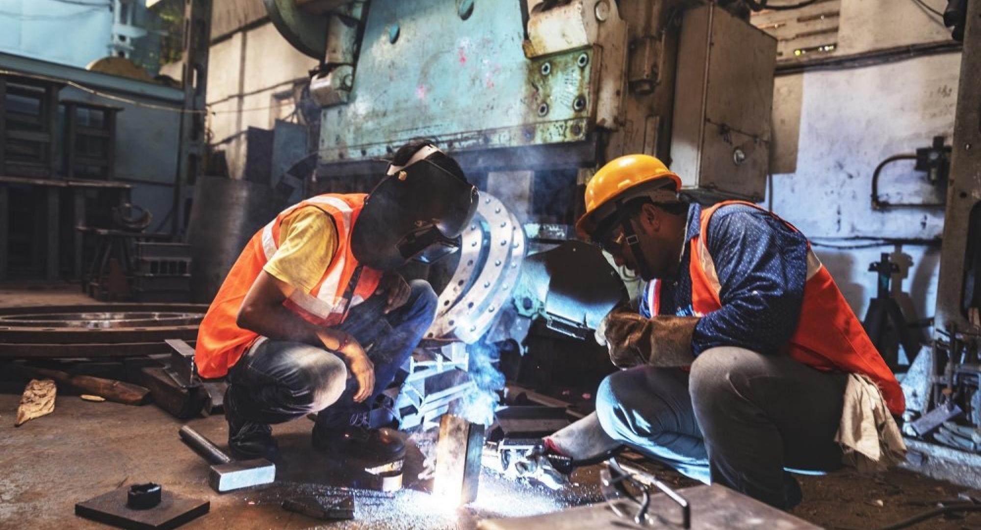 An apprenticeship working whilst being observed by mentor.