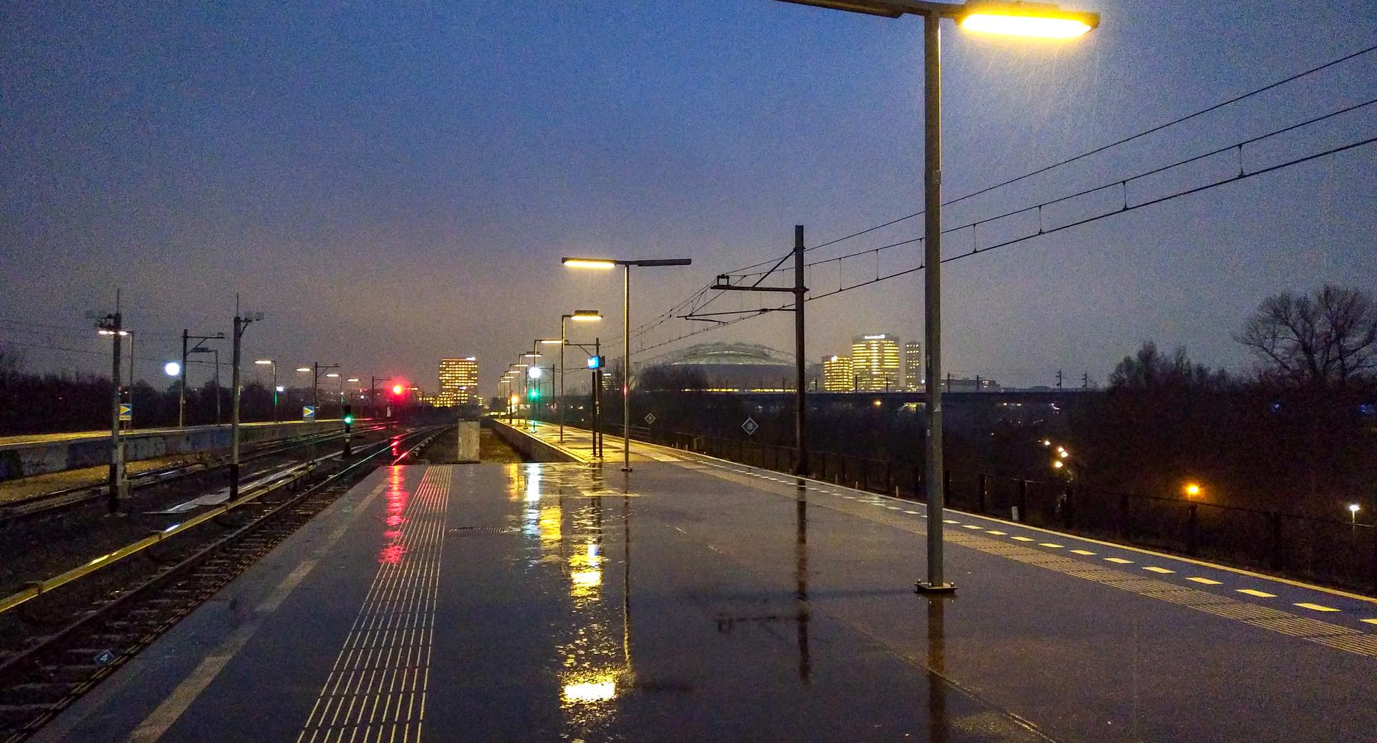 Railway platform during heavy rain