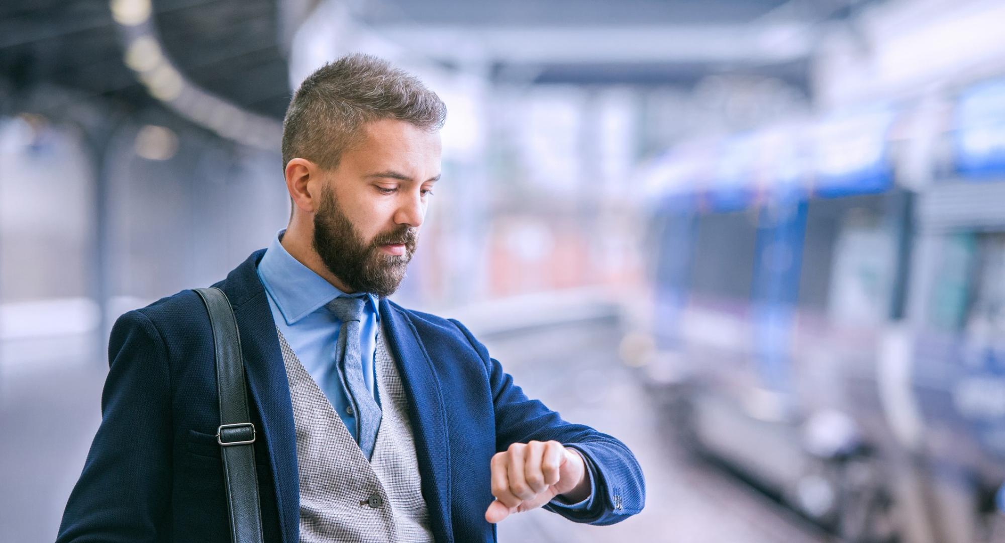 Businessman at a train platform