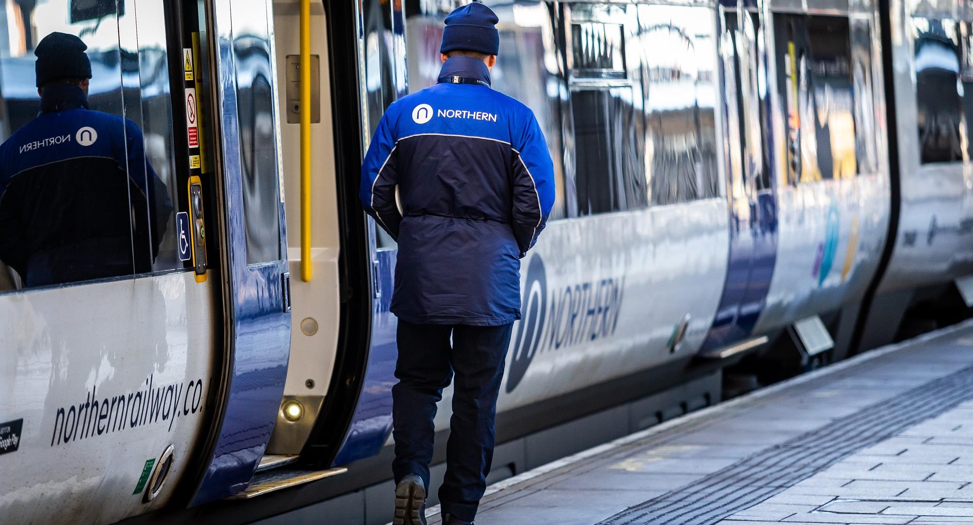 Northern conductor at open doors, via Northern 