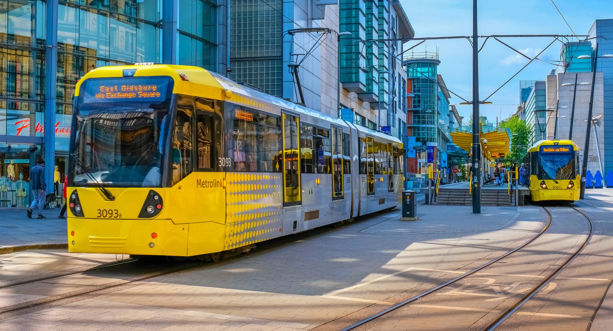 Light rail Metrolink tram in the city center of Manchester, UK. Via Istock