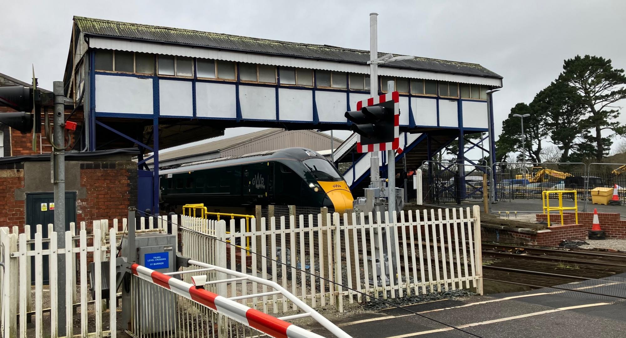 GWR train at Truro station with level crossing that will be upgraded