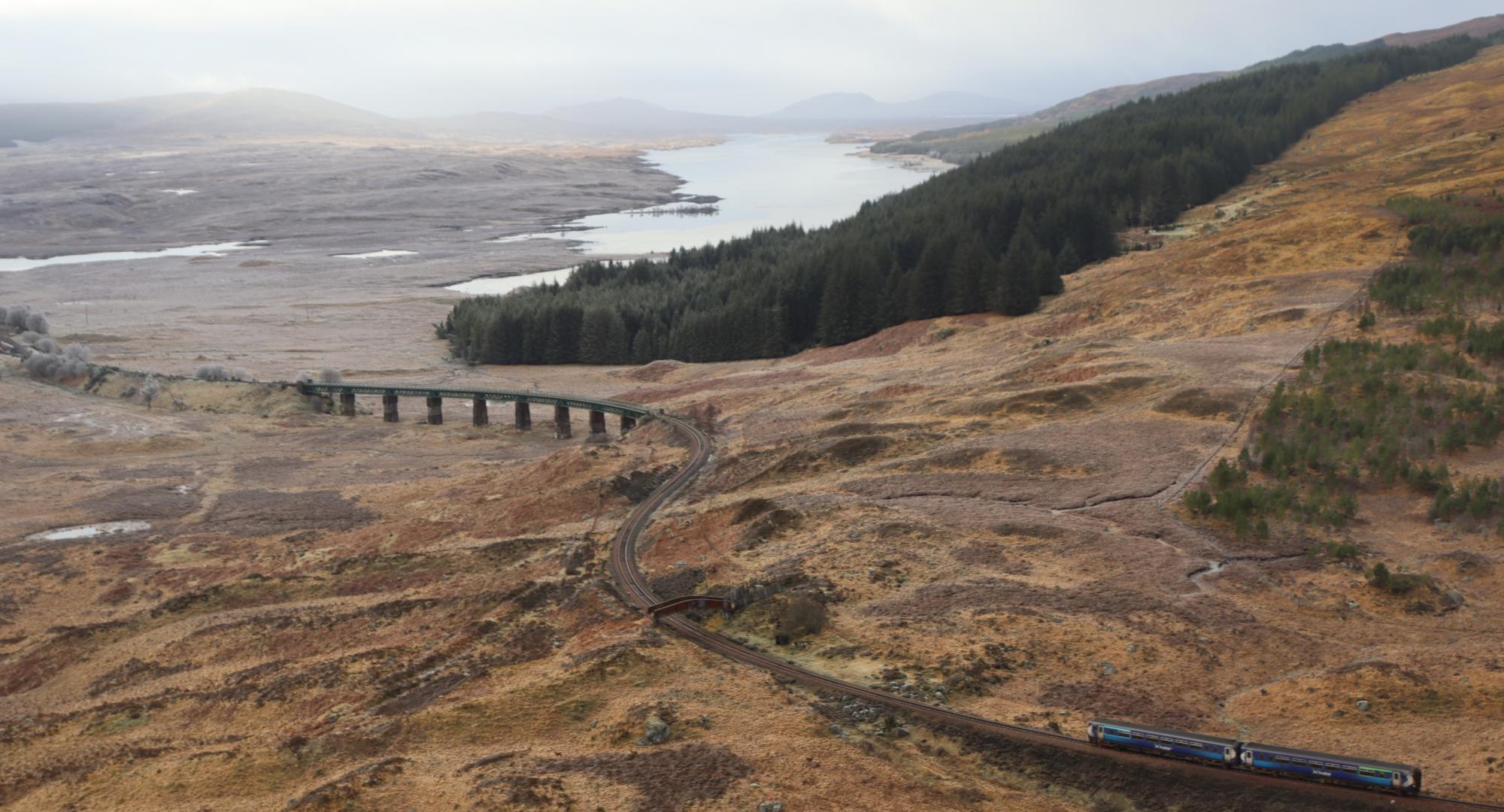 ScotRail train approaches Rannoch Viaduct