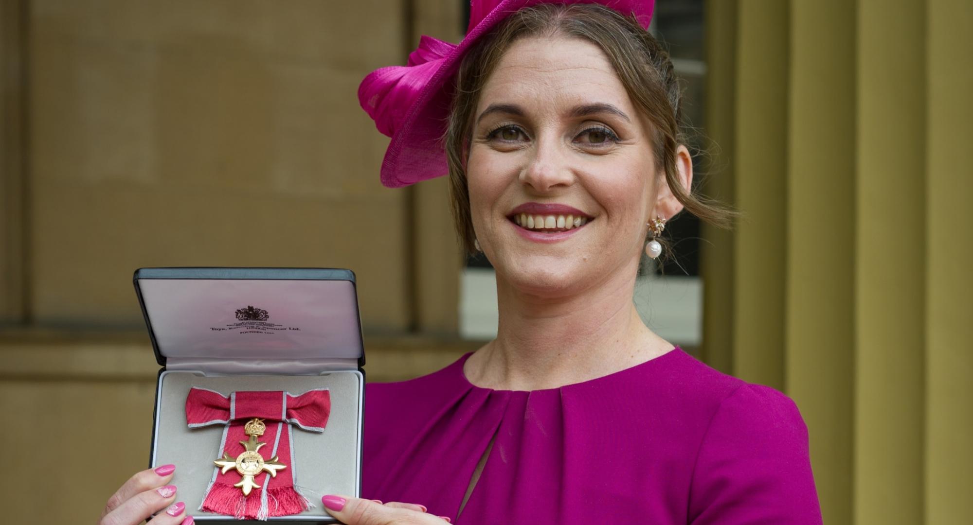 Ruth Busby with her OBE