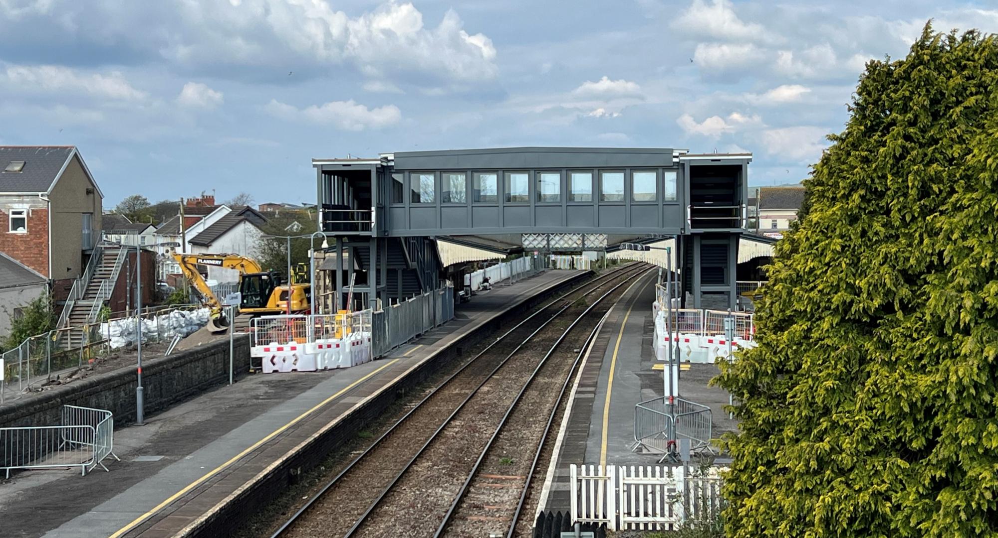 Bridge span is installed at Llanelli station as part of construction of accessible footbridge