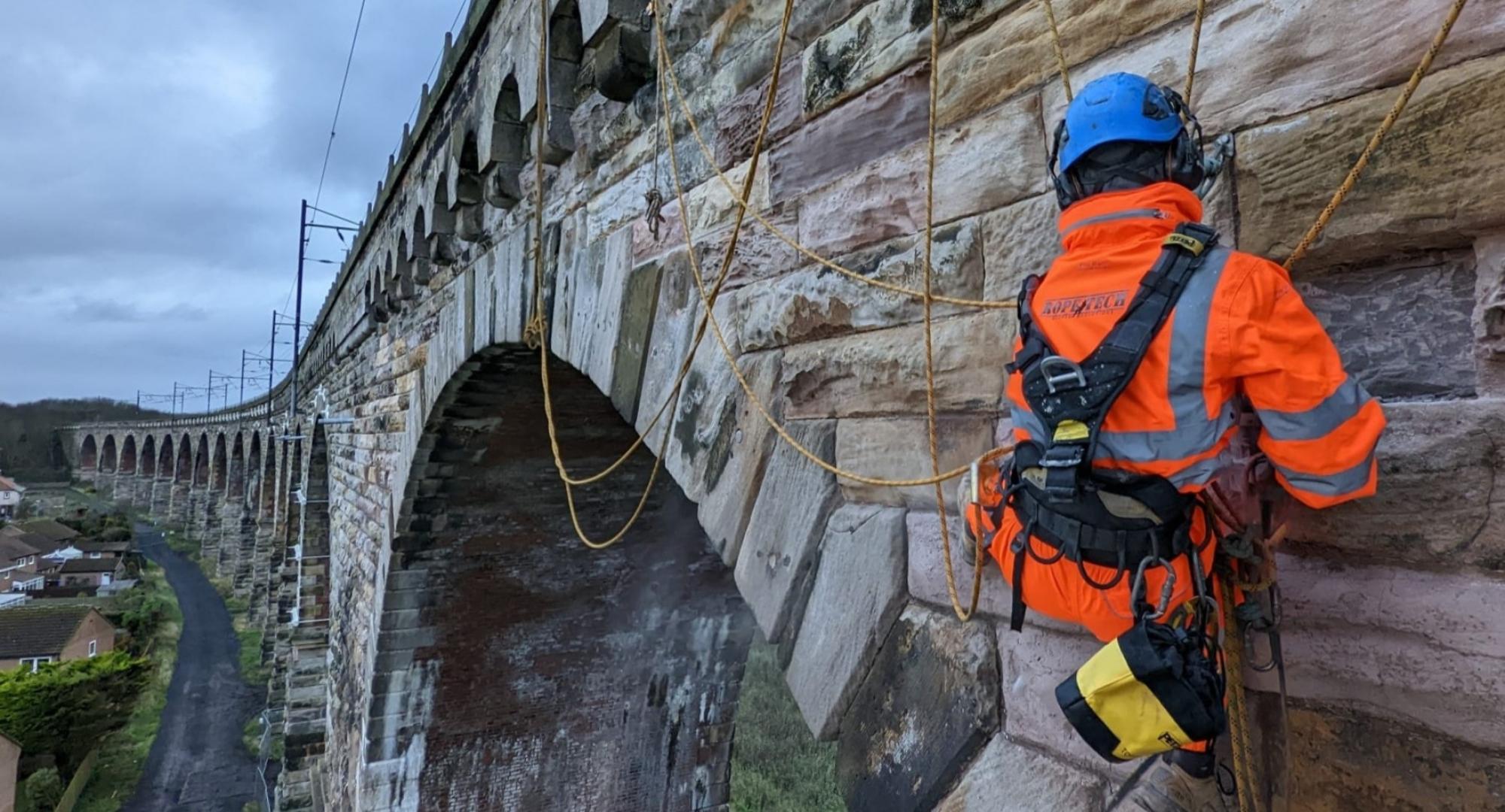 Man working on rail bridge 