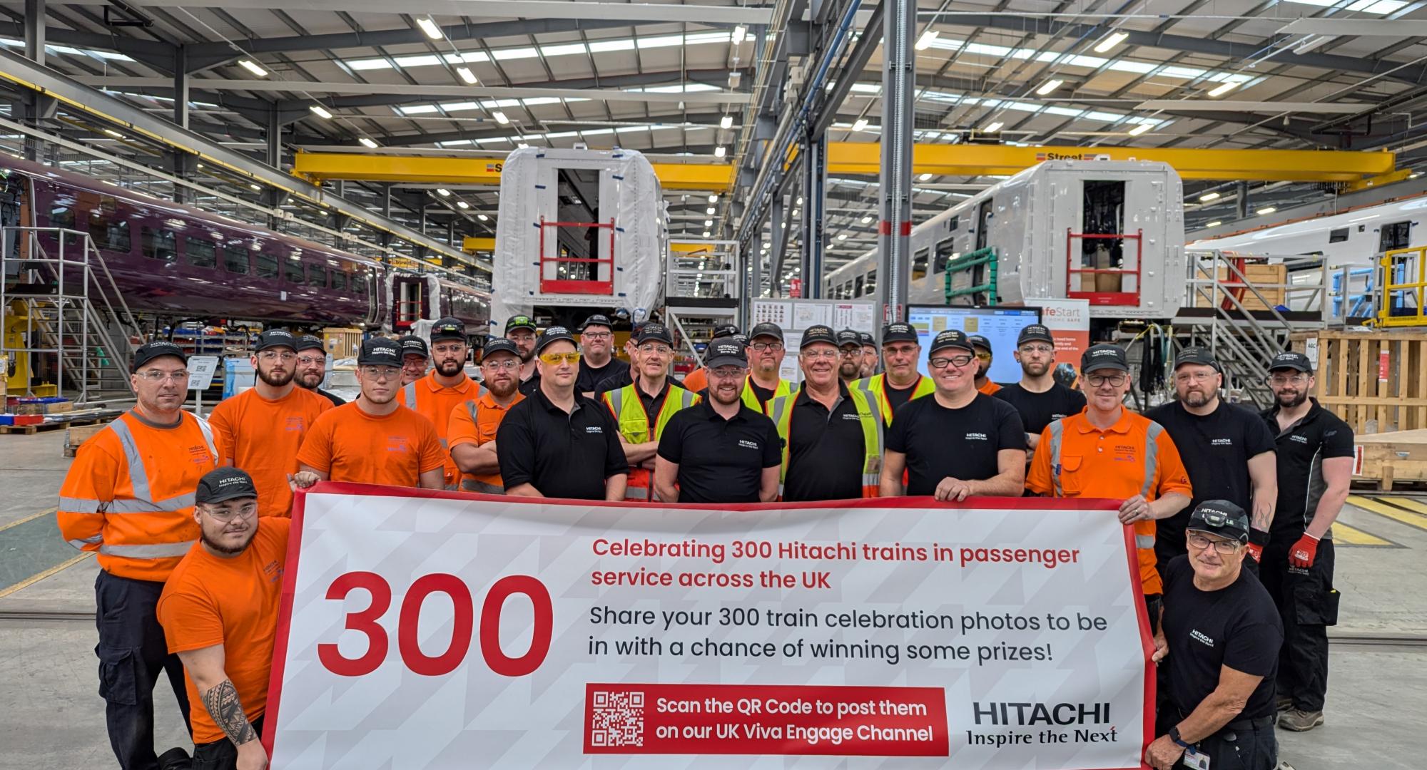 Staff celebrating 300th Hitachi Train
