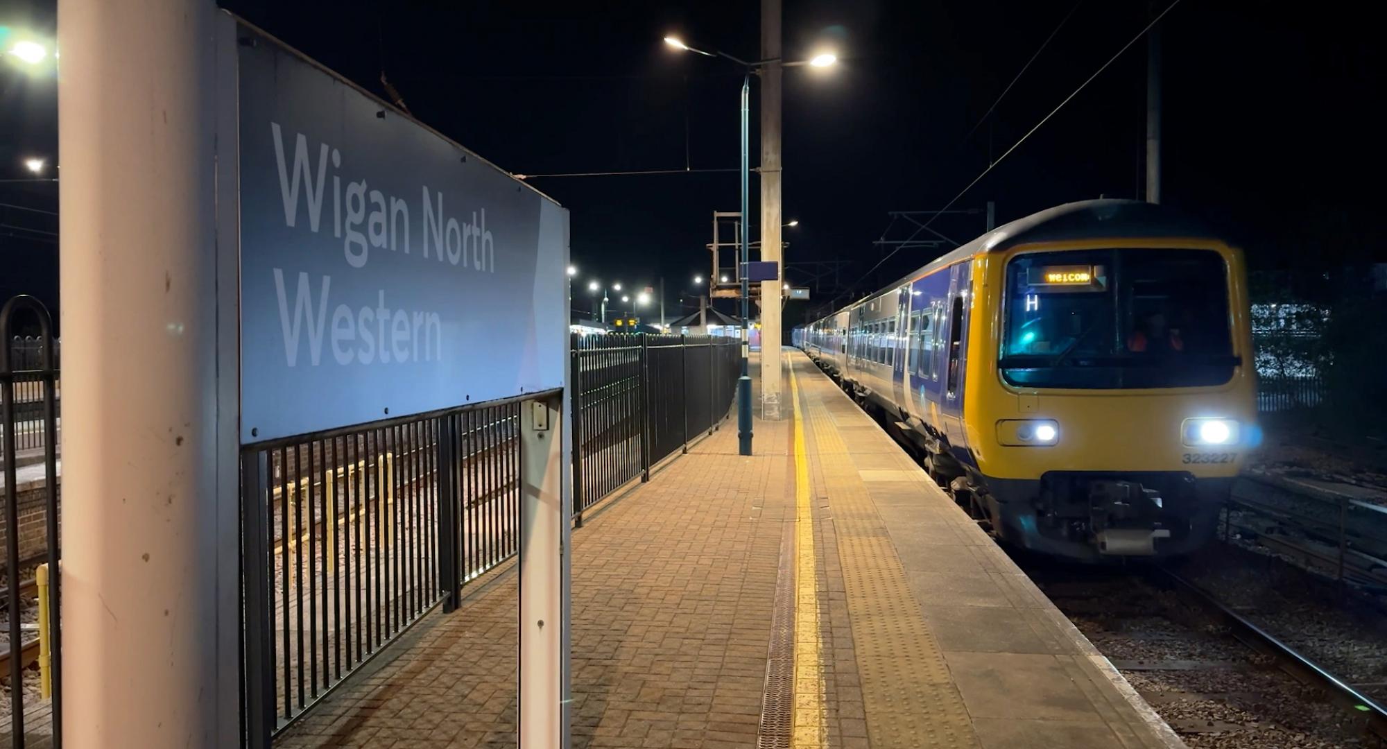 First shot of an electric train leaving Wigan North Western and Bolton under electric power